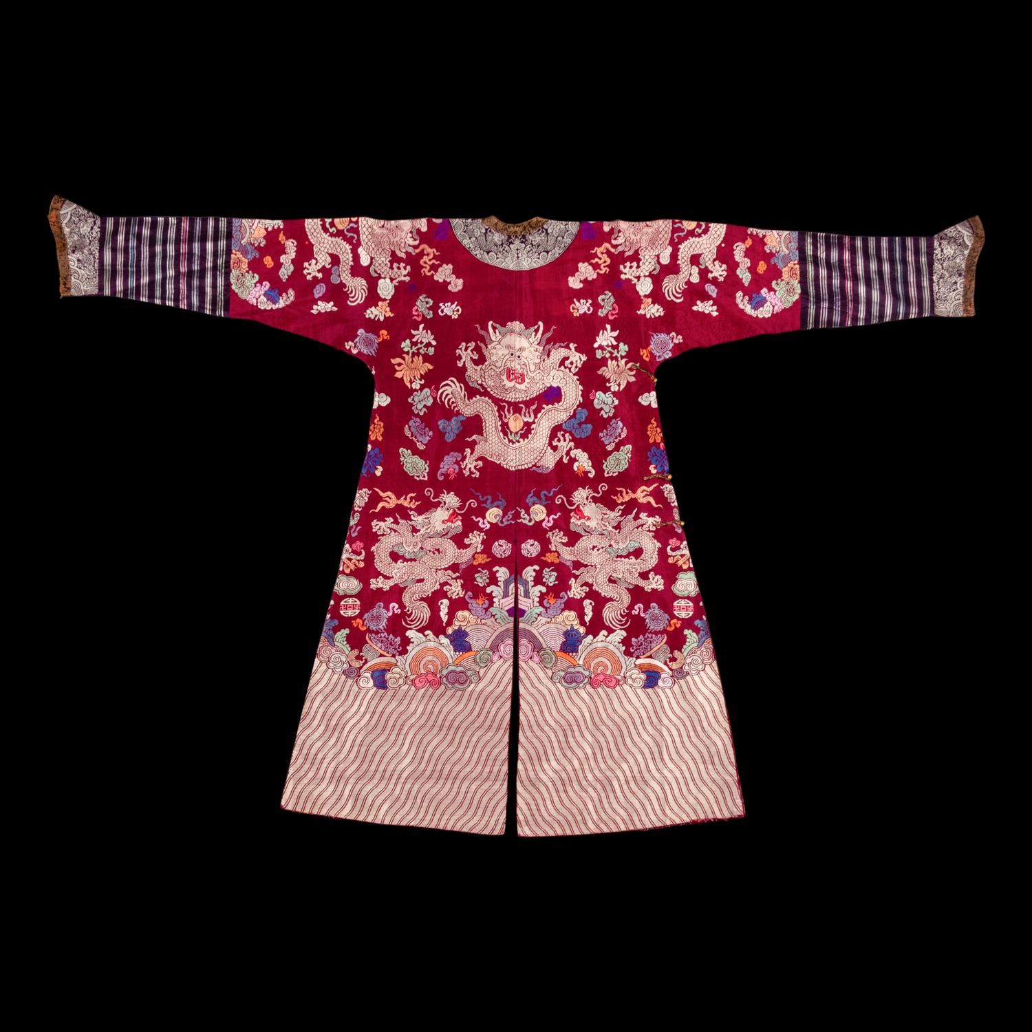 A Chinese Maroon Ground Silk Brocade 'Dragon' Robe, Jifu, Late Qing Dynasty 清晚期 絳紅地織錦龍紋吉服