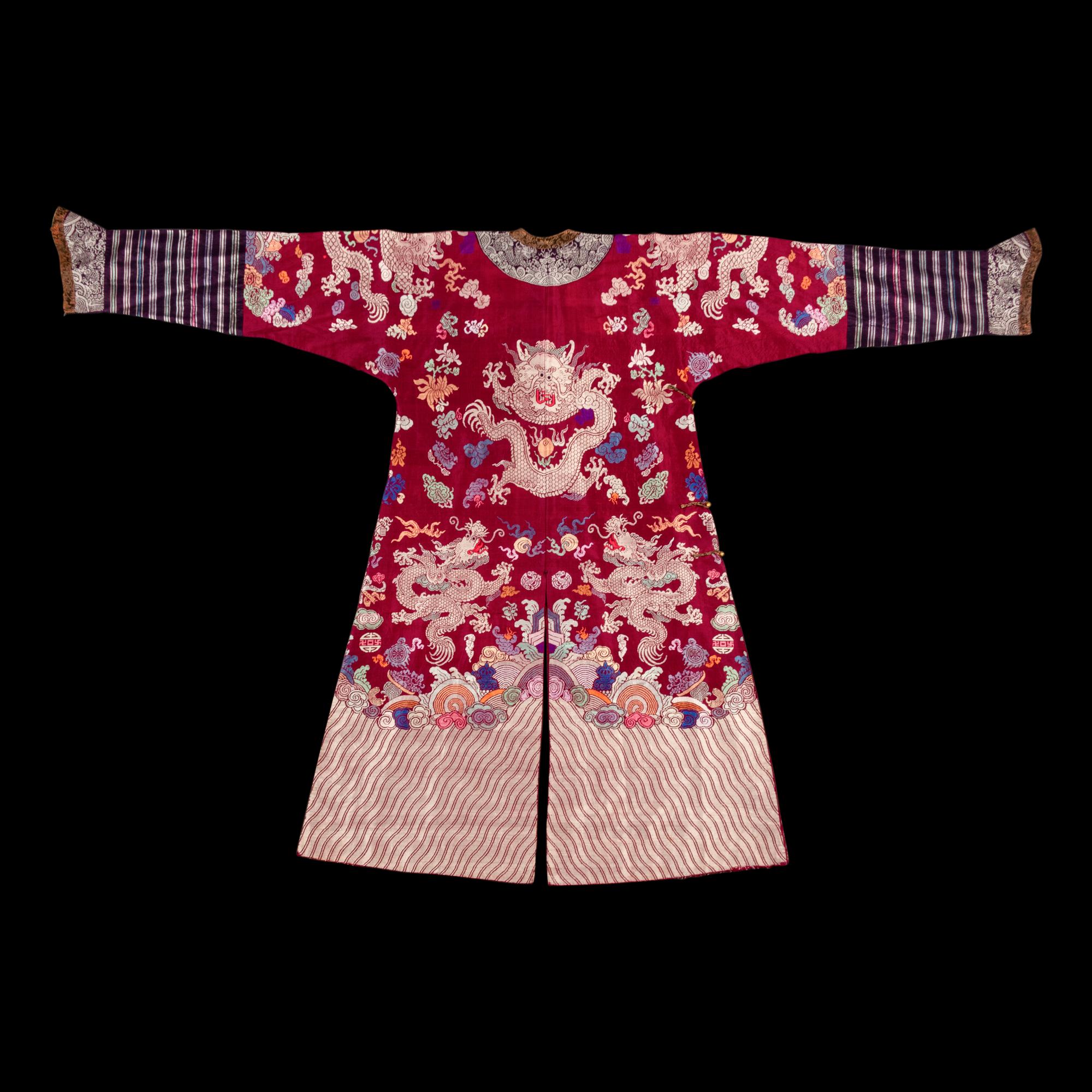A Chinese Maroon Ground Silk Brocade 'Dragon' Robe, Jifu, Late Qing Dynasty 清晚期 絳紅地織錦龍紋吉服