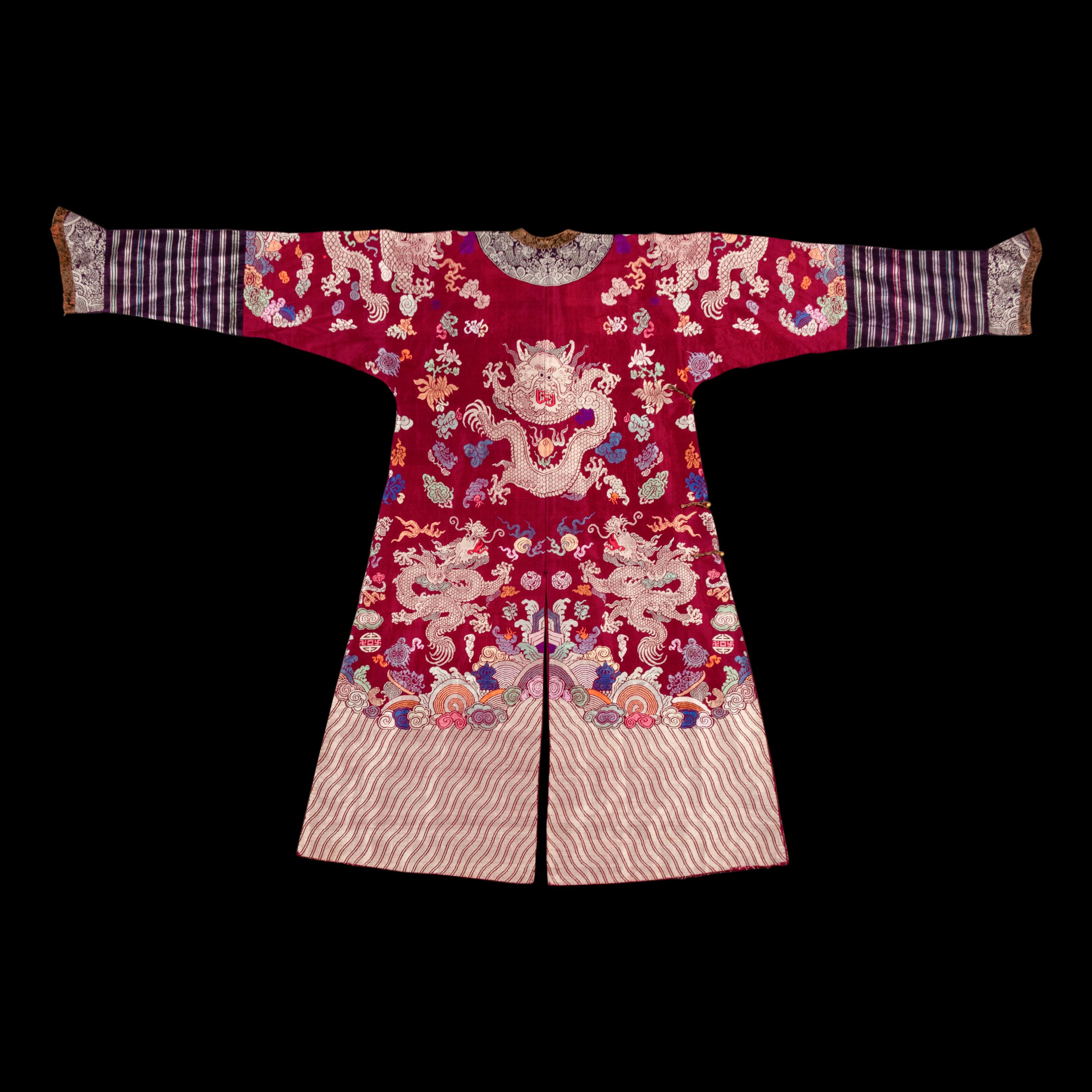 A Chinese Maroon Ground Silk Brocade 'Dragon' Robe, Jifu, Late Qing Dynasty 清晚期 絳紅地織錦龍紋吉服