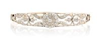 An Antique Platinum Topped Gold and Diamond Bangle, 11.40 dwts.