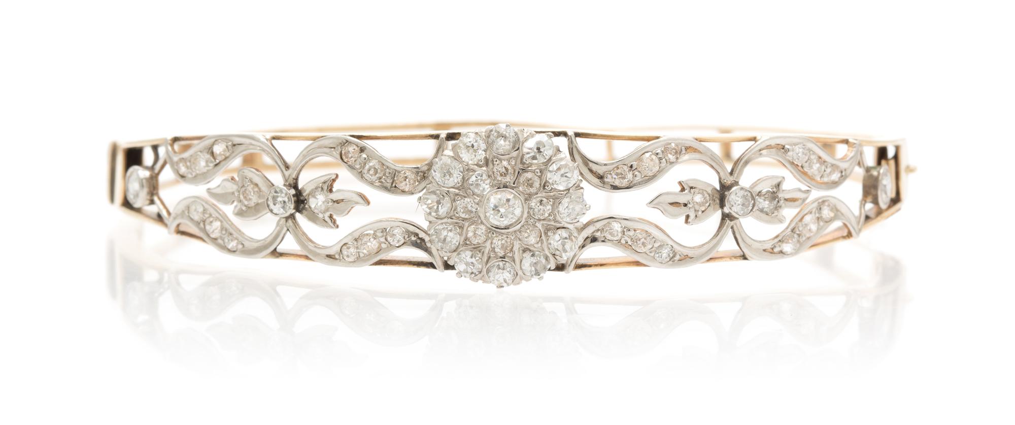 An Antique Platinum Topped Gold and Diamond Bangle, 11.40 dwts.