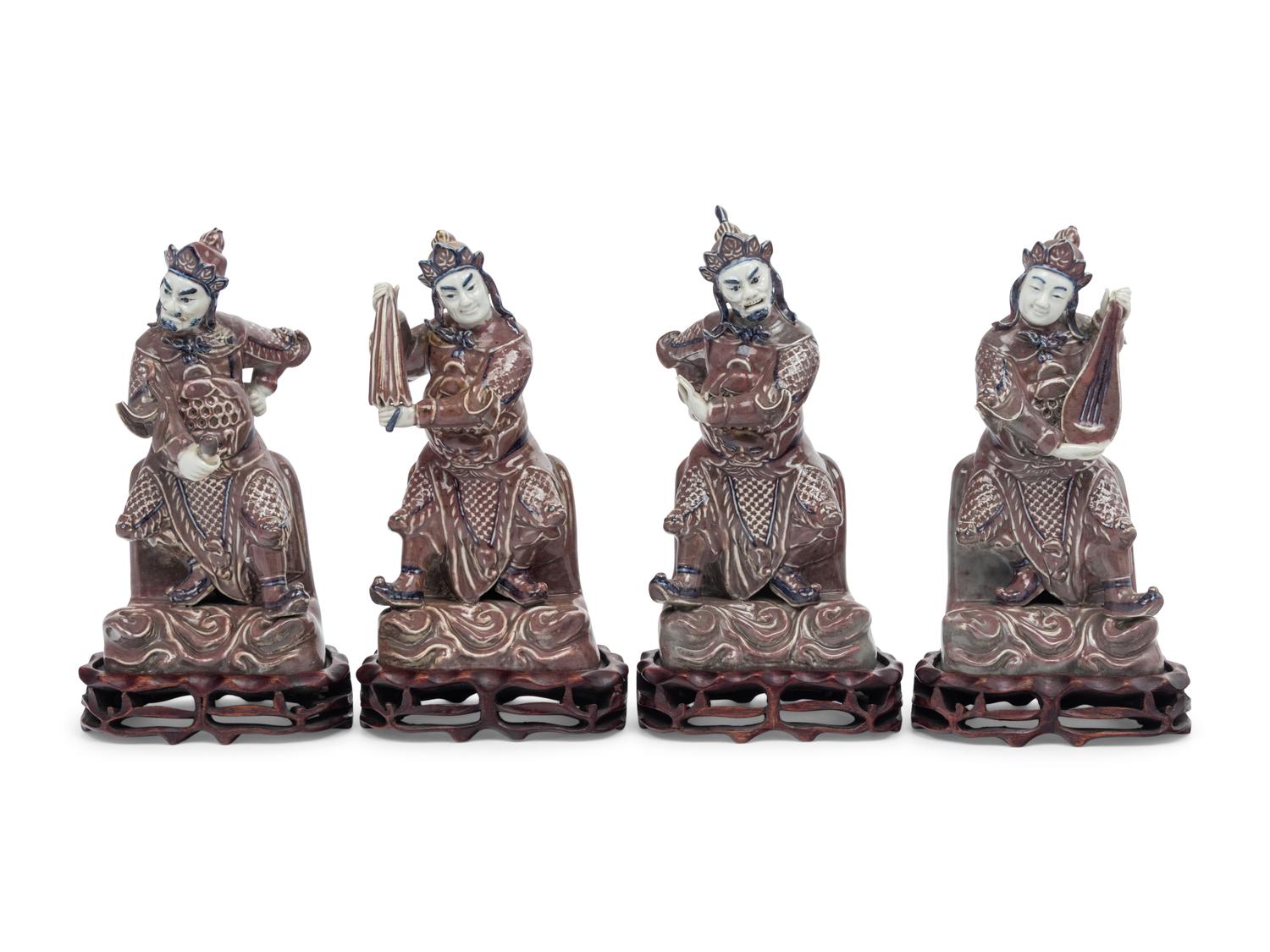 A Set of Four Chinese Underglaze Blue and Red Porcelain Figures of Guardians