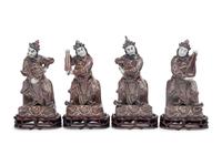 A Set of Four Chinese Underglaze Blue and Red Porcelain Figures of Guardians