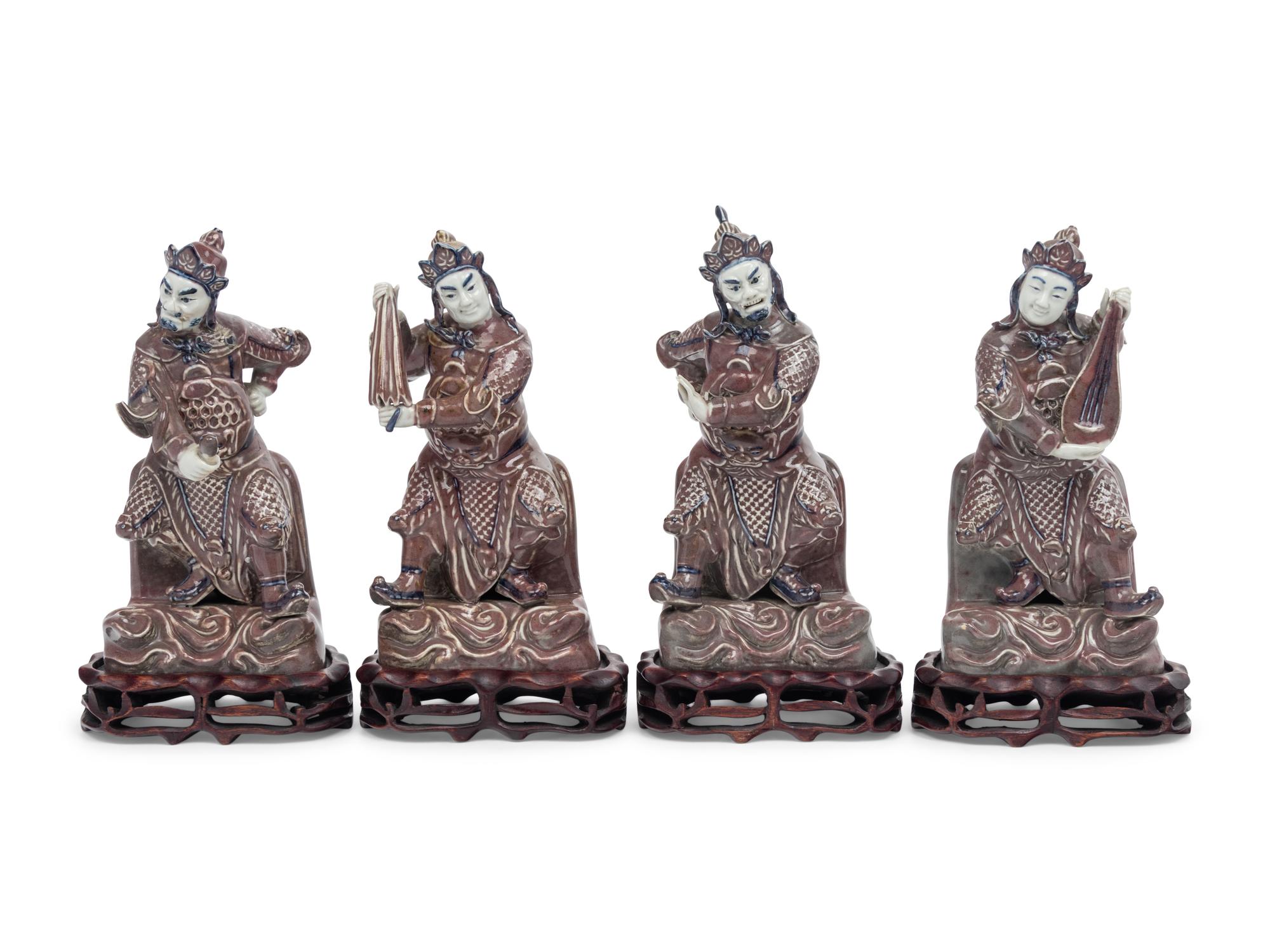 A Set of Four Chinese Underglaze Blue and Red Porcelain Figures of Guardians