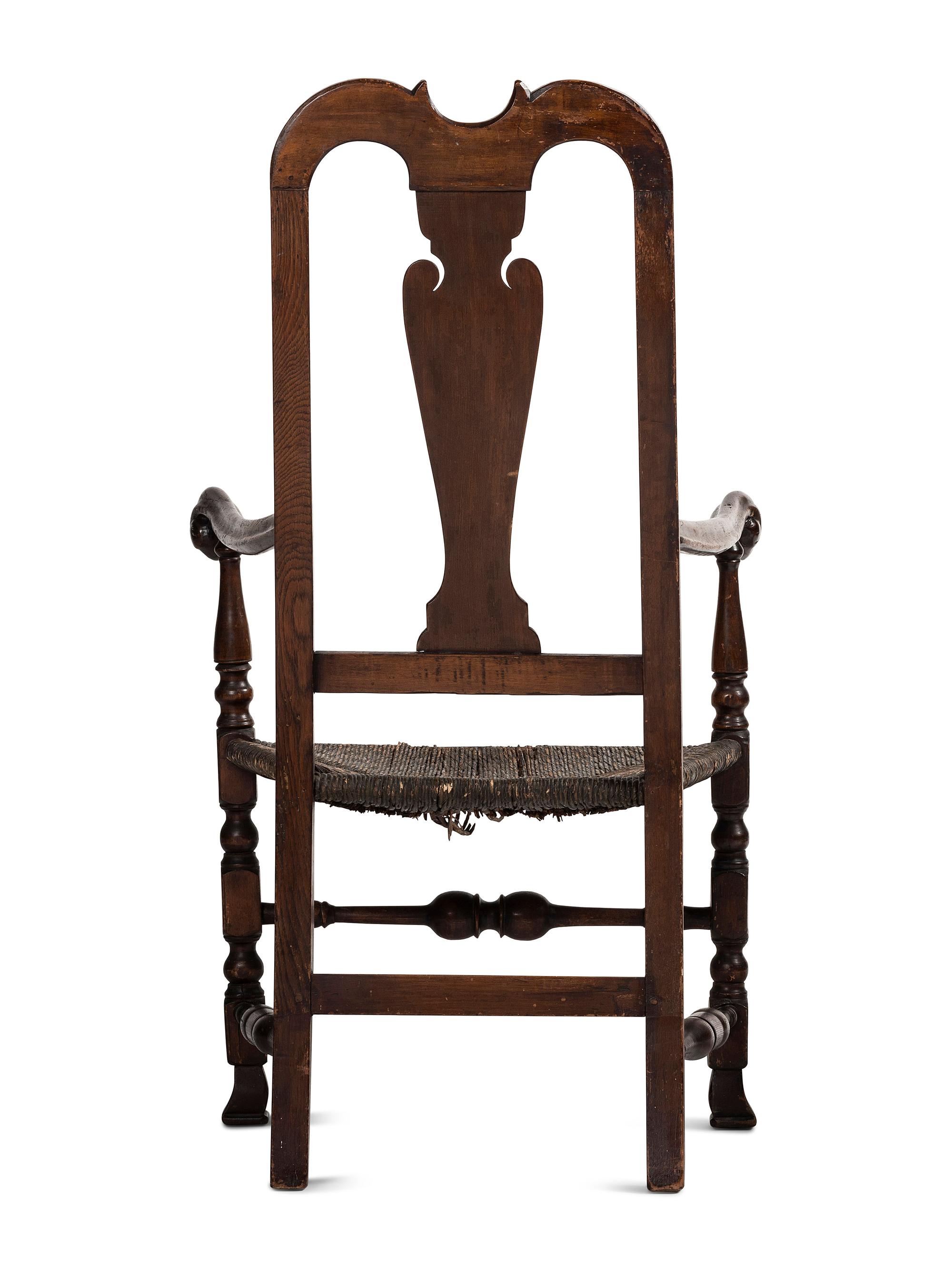 A Queen Anne Mixed Woods Rush-Seat Spanish-Foot Armchair