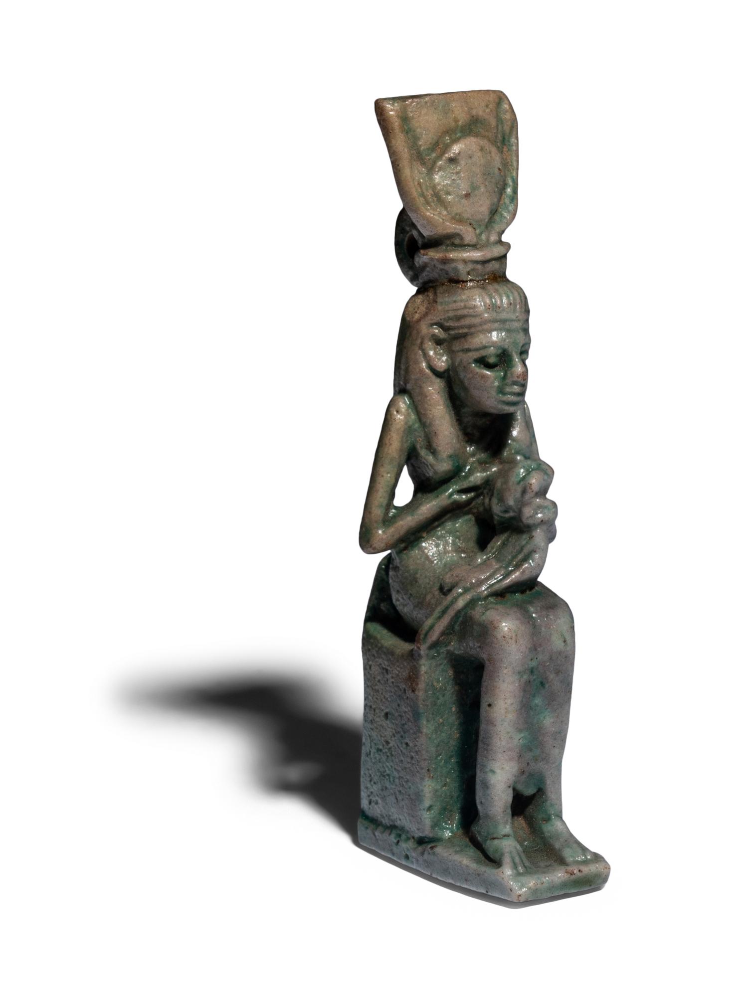 An Egyptian Faience Isis Nursing Horus Amulet