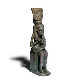 An Egyptian Faience Isis Nursing Horus Amulet