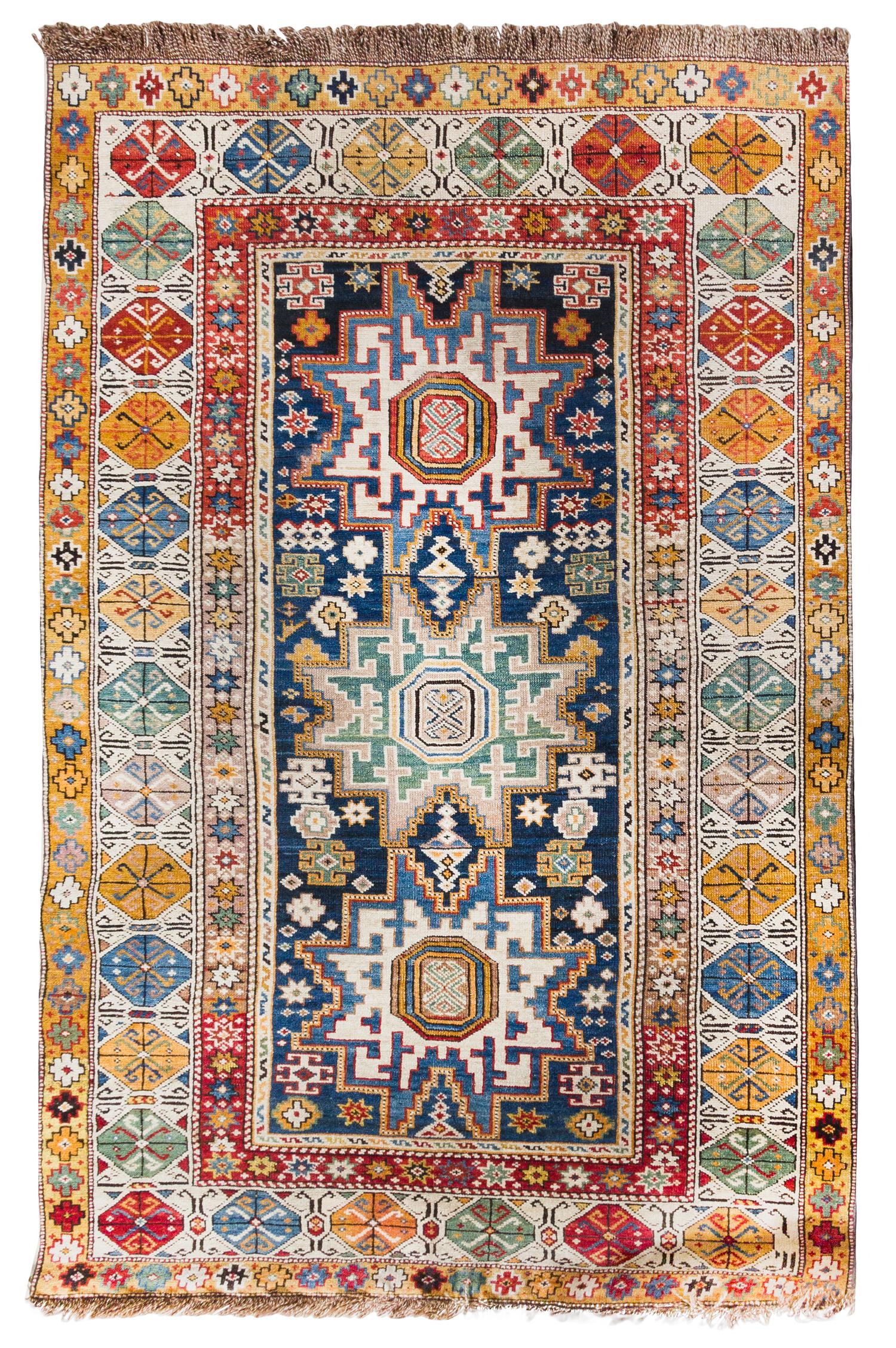 A Caucasian Wool Rug 5 feet 6 inches x 3 feet 6 inches. — 19TH CENTURY