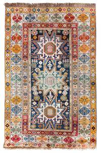 A Caucasian Wool Rug 5 feet 6 inches x 3 feet 6 inches. — 19TH CENTURY