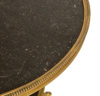 A Pair of French Empire Style Gilt Bronze and Black Marble Two Tier Gueridon Tables