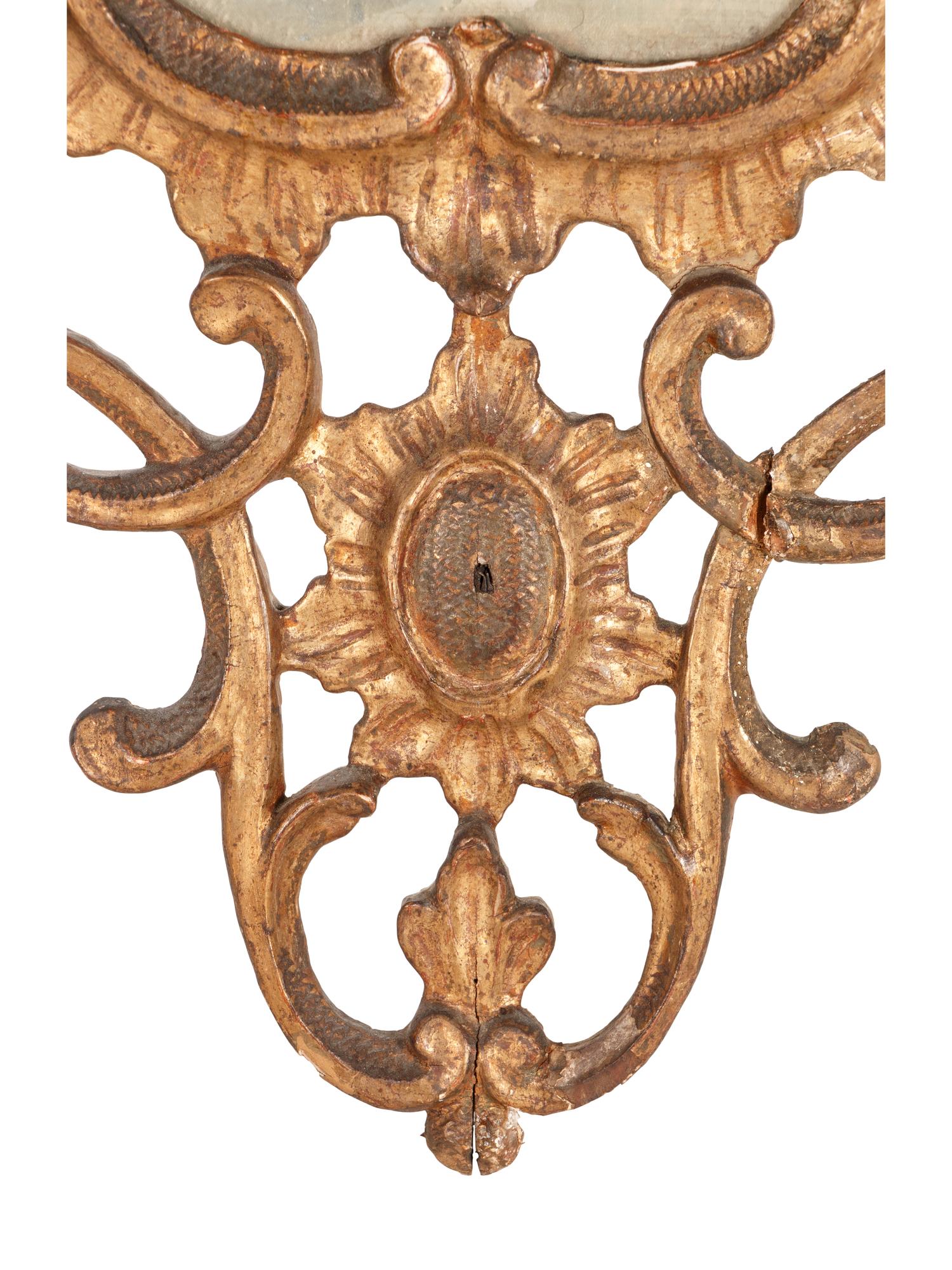 An Italian Baroque Style Giltwood Mirror