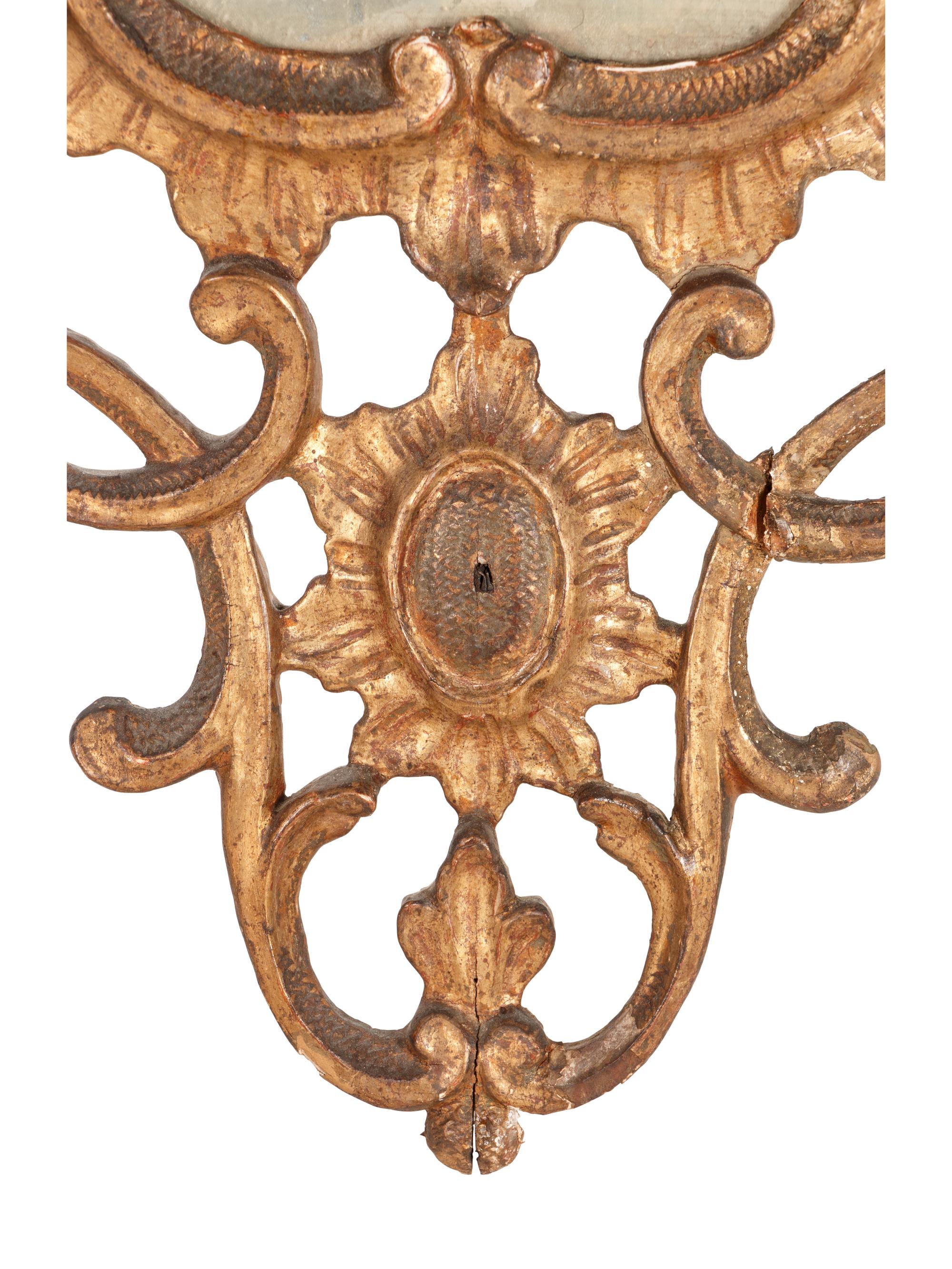 An Italian Baroque Style Giltwood Mirror