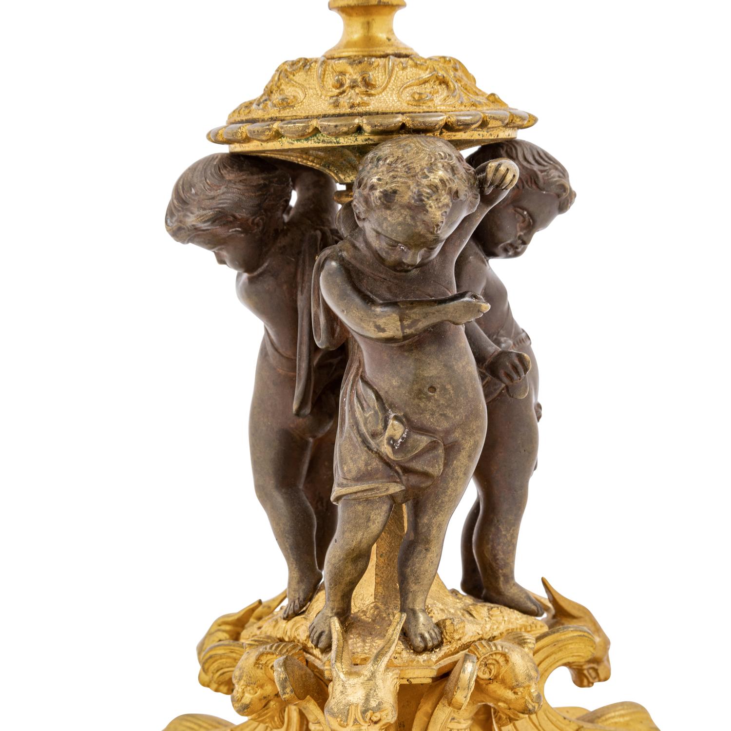 A Pair of French Bronze Candlesticks