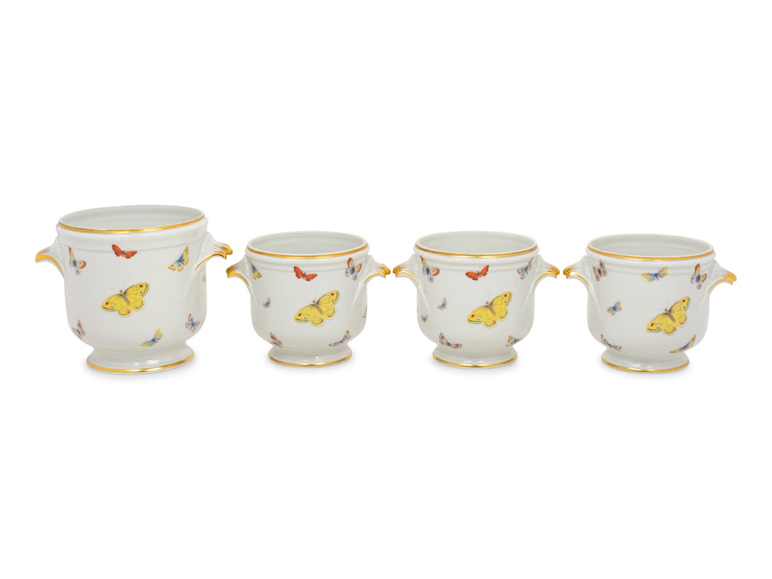 A Set of Four Limoges Porcelain Cache Pots