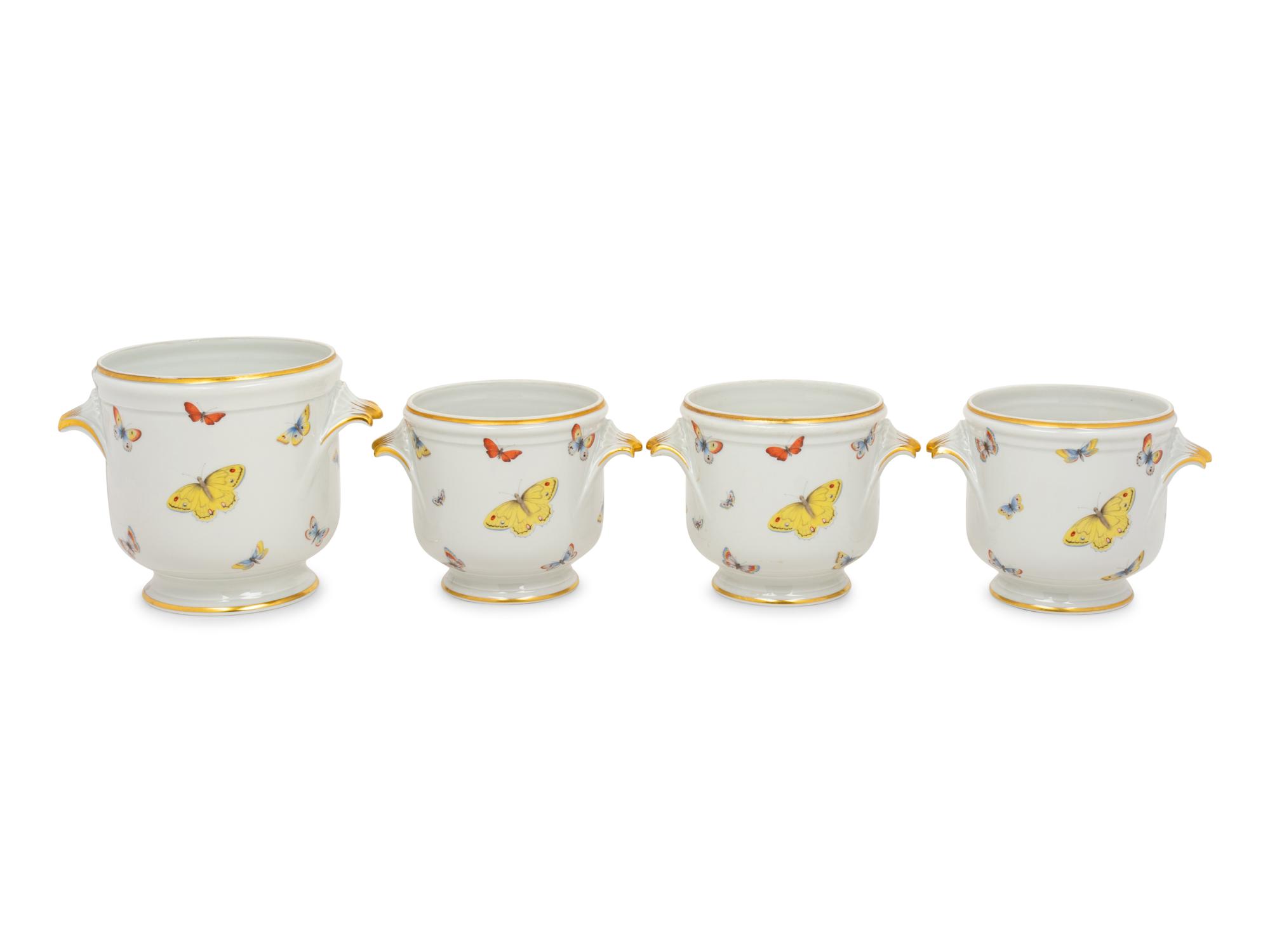 A Set of Four Limoges Porcelain Cache Pots