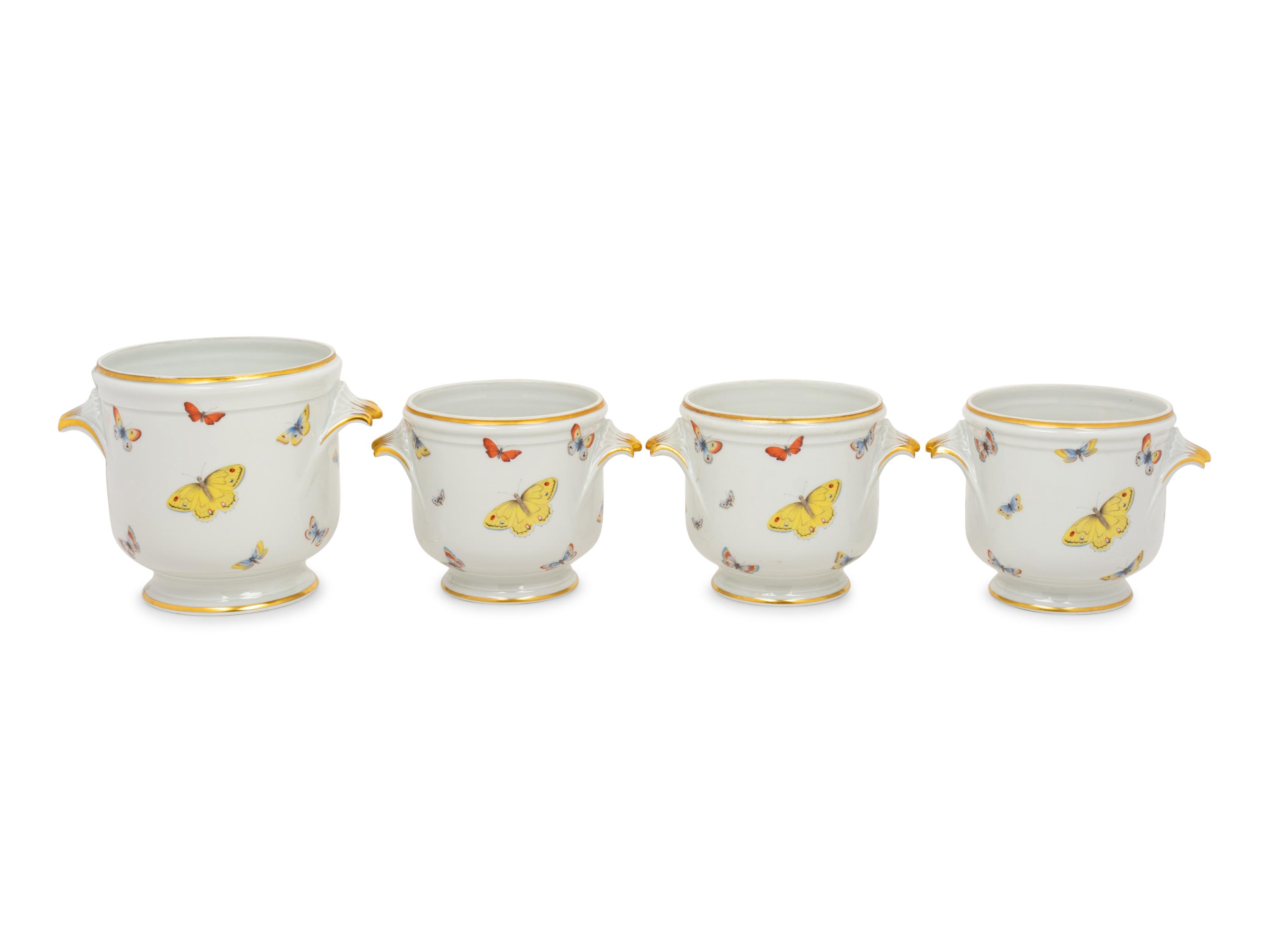 A Set of Four Limoges Porcelain Cache Pots
