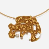 A gold and diamond pendant/brooch and choker