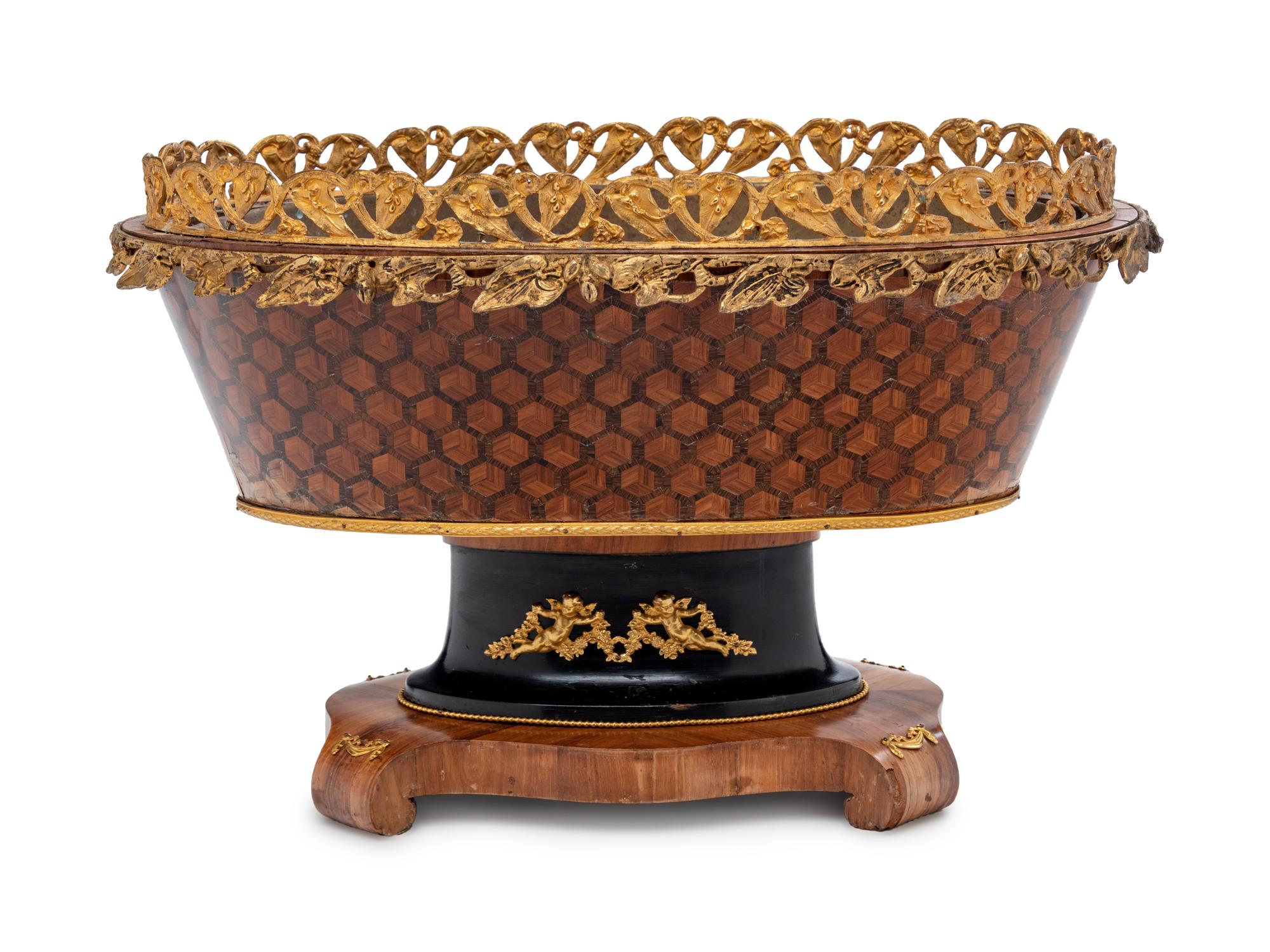 A Napoleon III Gilt Metal Mounted, Parcel Ebonized and Parquetry Jardinière