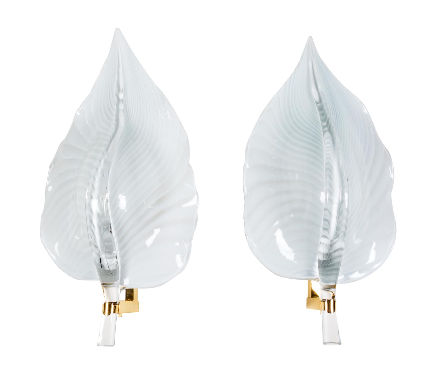 A Contemporary White Glass and Brass Eight-Light Chandelier Height of chandelier 30 inches.