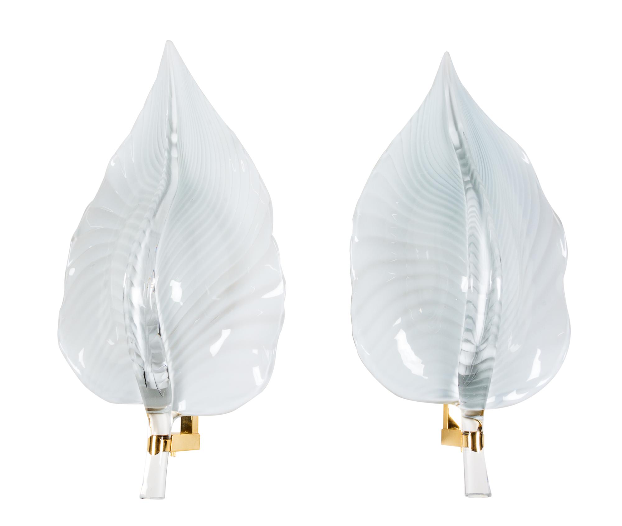 A Contemporary White Glass and Brass Eight-Light Chandelier Height of chandelier 30 inches.