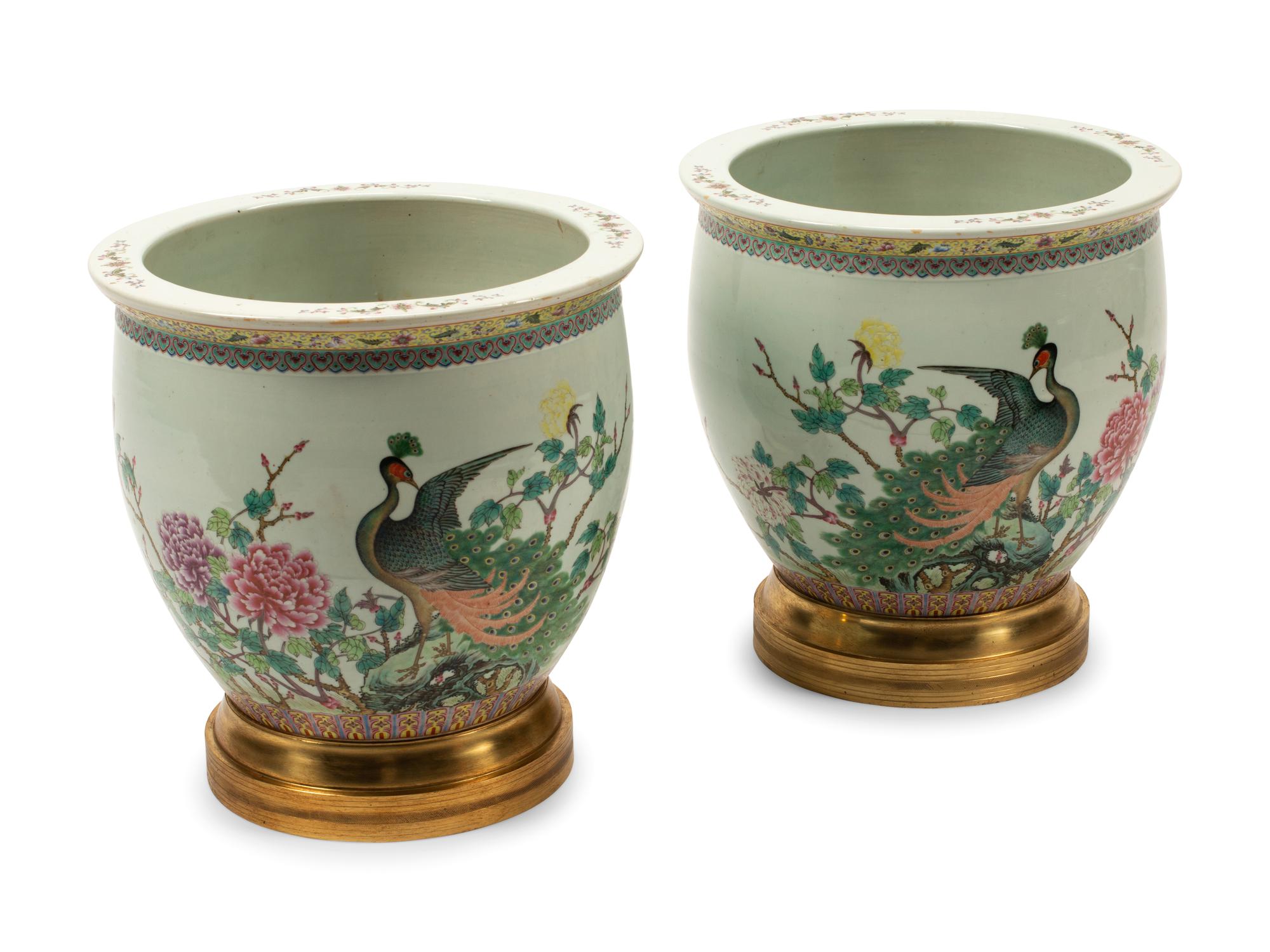 A Pair of Chinese Porcelain Jardinieres with Gilt Bronze Bases
