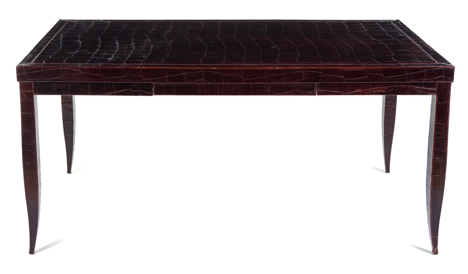 An Art Deco Style Embossed Leather-Veneered Writing Table Height 30 1/2 x width 53 x depth 33 inches. — 20TH CENTURY