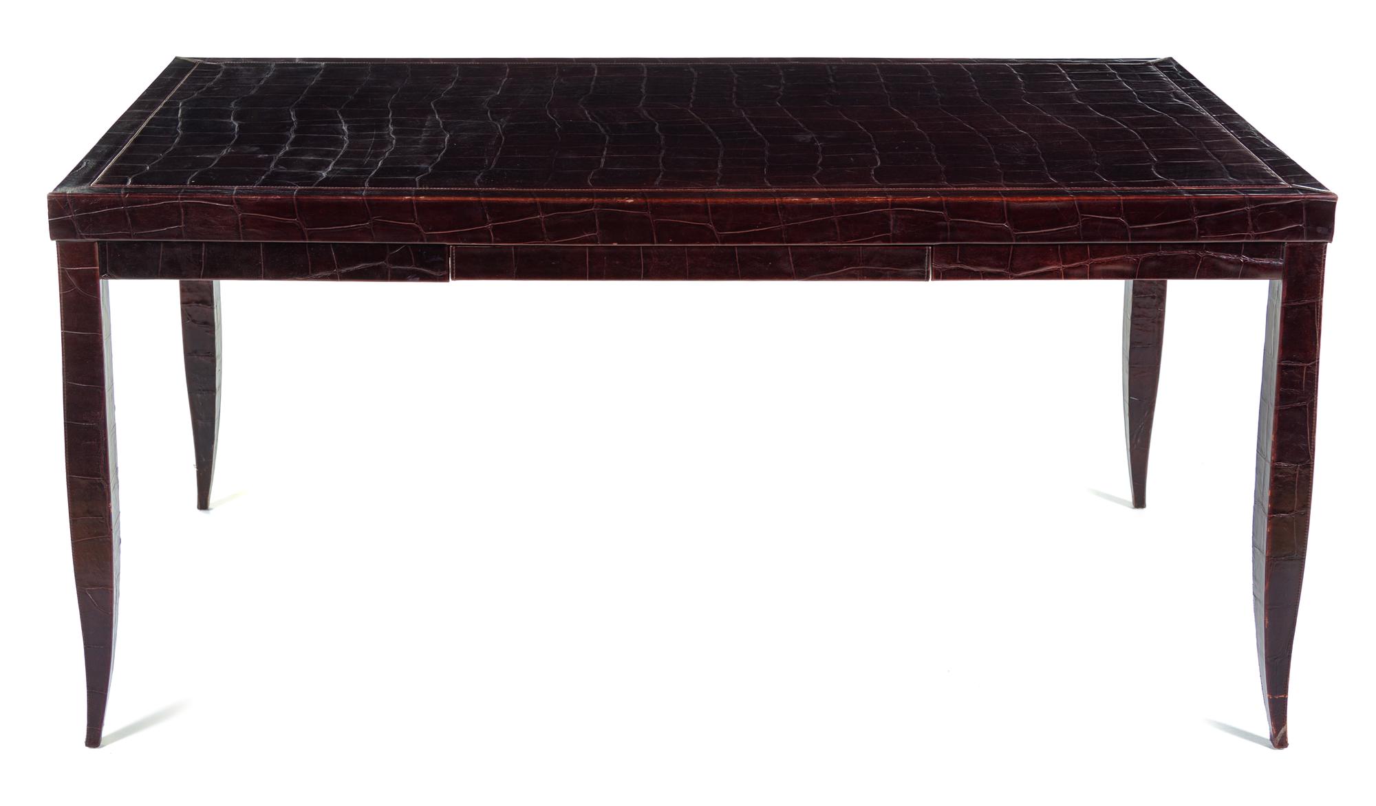 An Art Deco Style Embossed Leather-Veneered Writing Table Height 30 1/2 x width 53 x depth 33 inches. — 20TH CENTURY