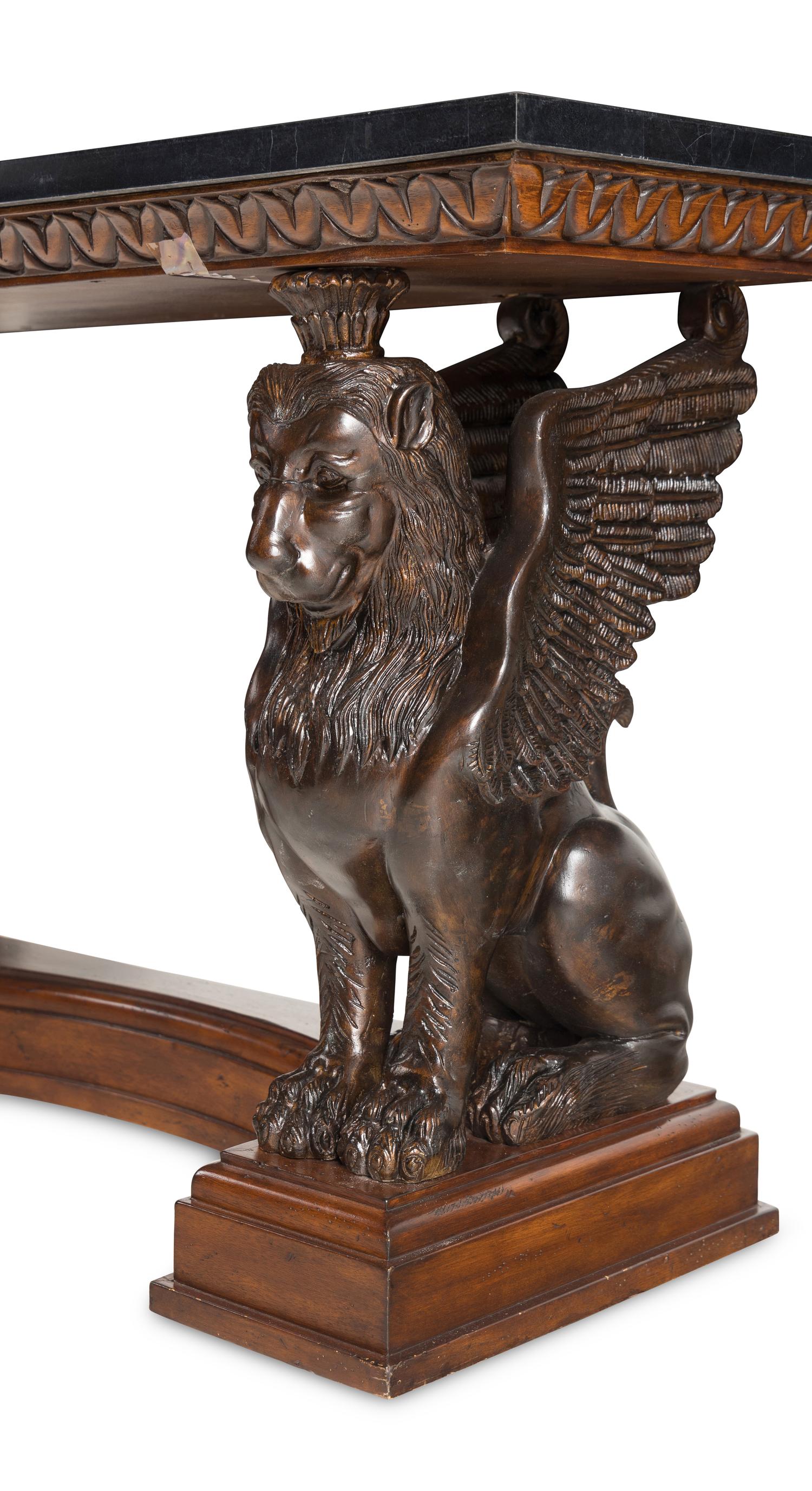 A Carved Wood Console Table with Lion Supports