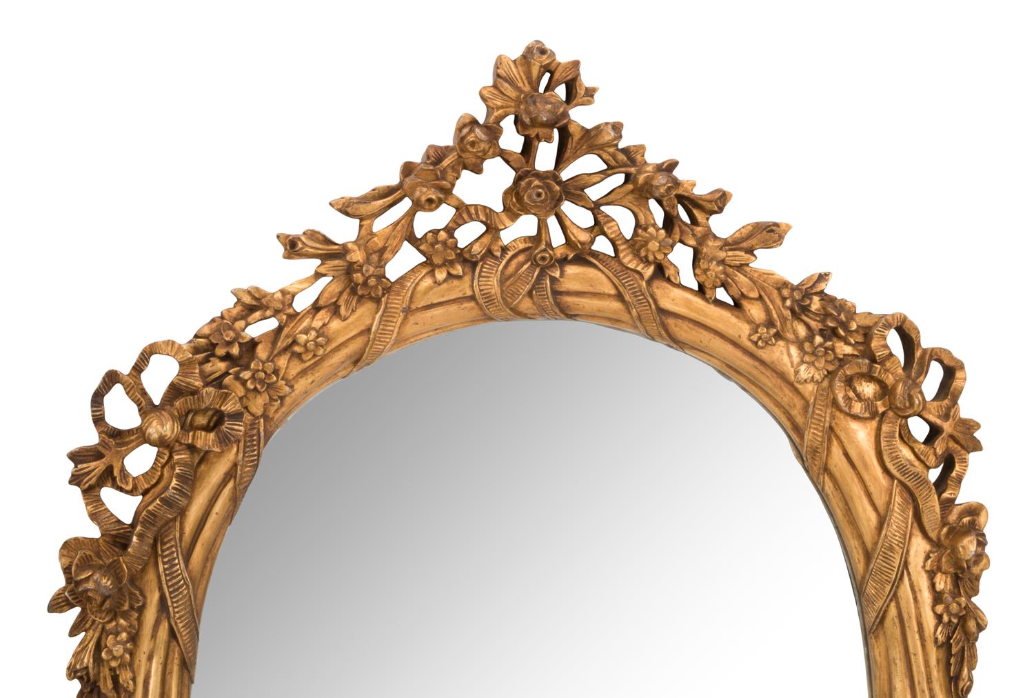 A Pair of Louis XV Style Giltwood Oval Mirrors