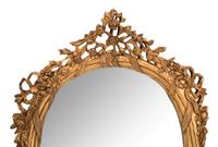 A Pair of Louis XV Style Giltwood Oval Mirrors
