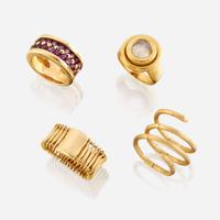 A collection of four eighteen karat gold rings