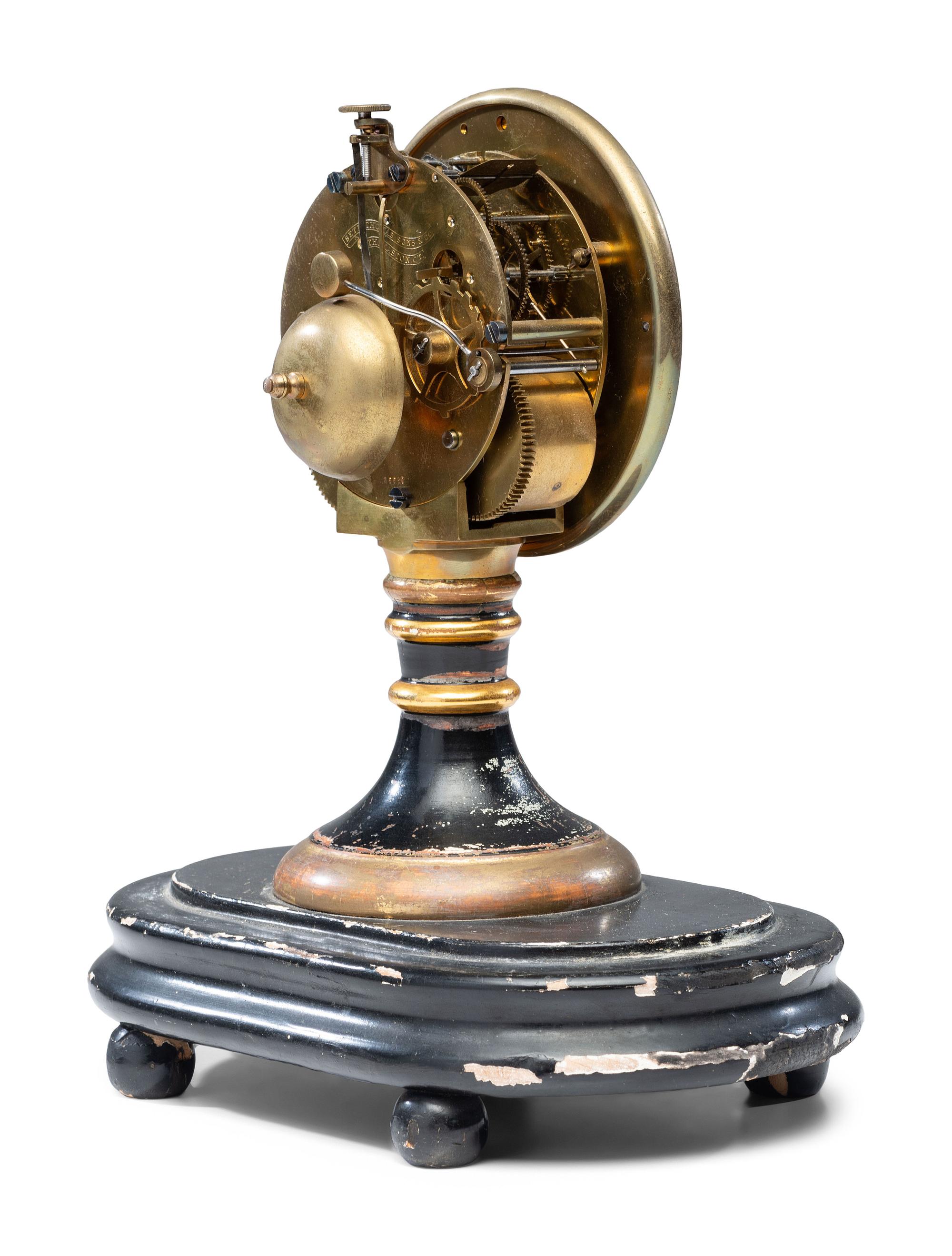 An Ebonized and Parcel Gilt Mantel Clock