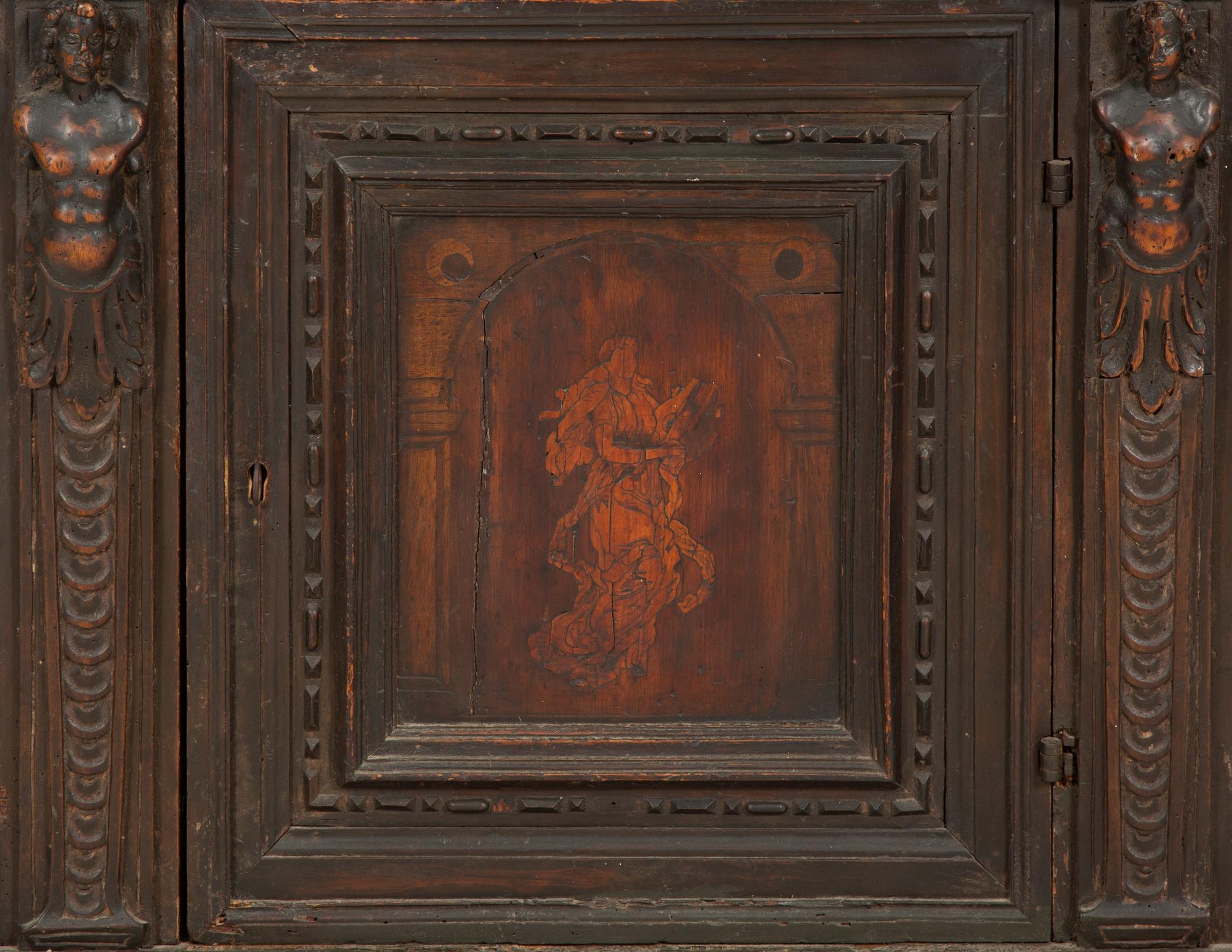 An Italian Carved Walnut Side Cabinet with Marquetry Panel Door