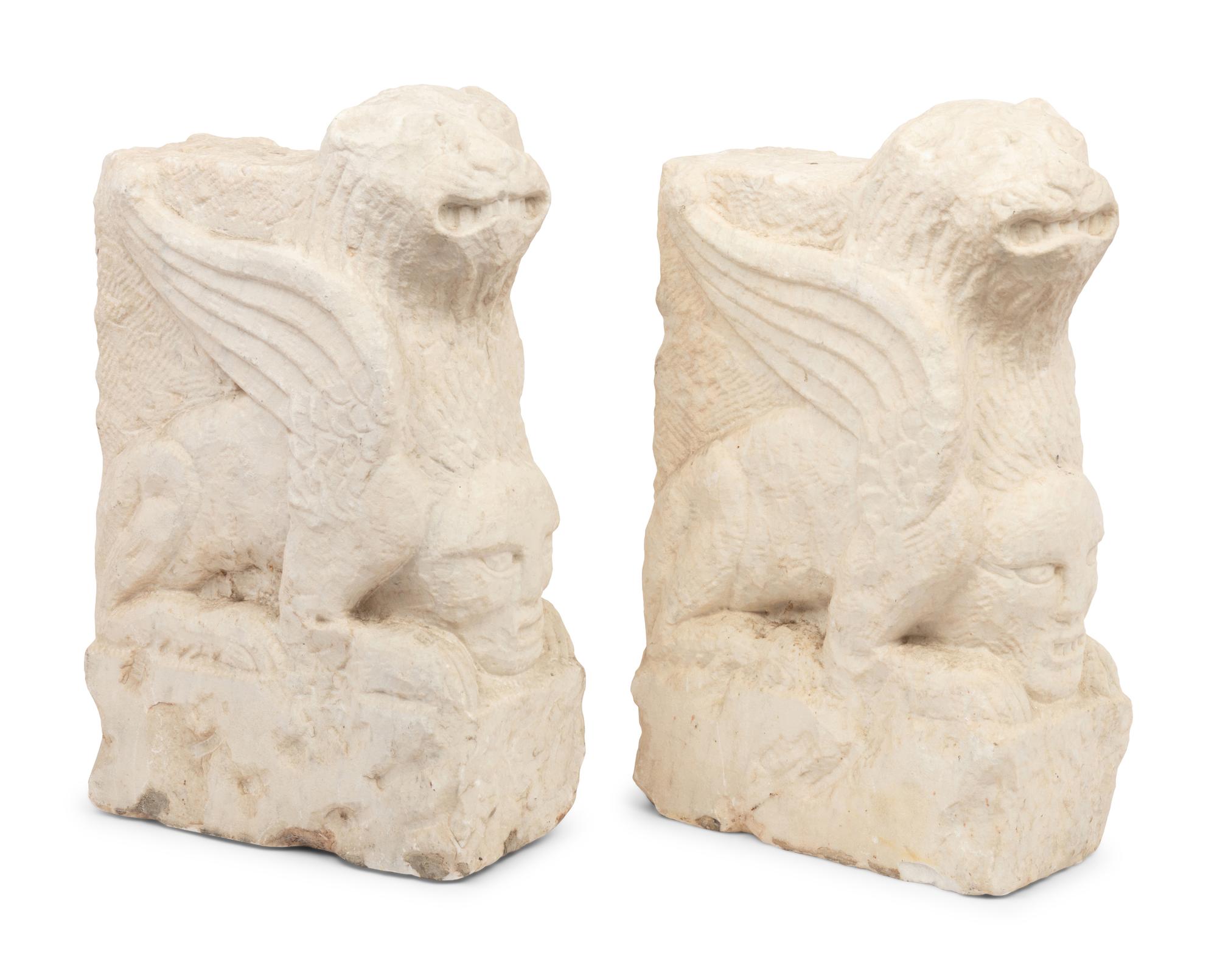 A Pair of Gothic Style Carved Marble Ornaments