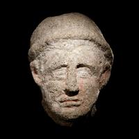 An Etruscan Over-Lifesized Nenfro Portrait Head of a Man