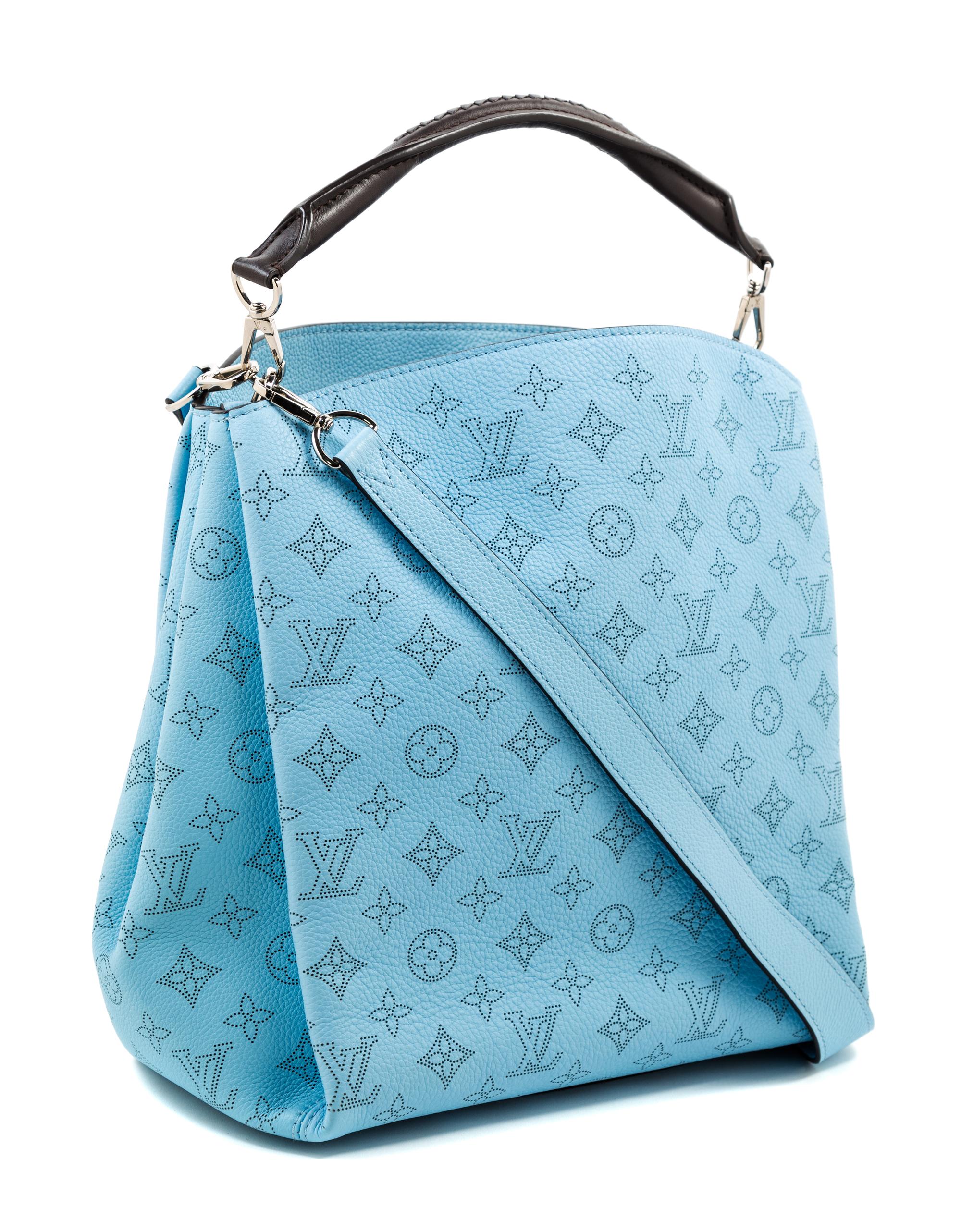 A Louis Vuitton Blue Selene Cross Body Satchel, 11" x 12" x 7"; Handle drop: 4"; Strap drop: 18".