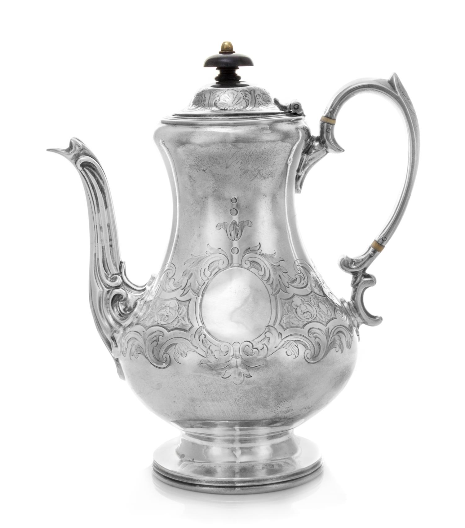 A Victorian Silver Coffee Pot, Daniel & Charles Houle, London, 1854, the baluster form body chased with floral and foliate motifs and h