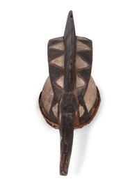 A Group of Ten Carved Ethnographic Masks