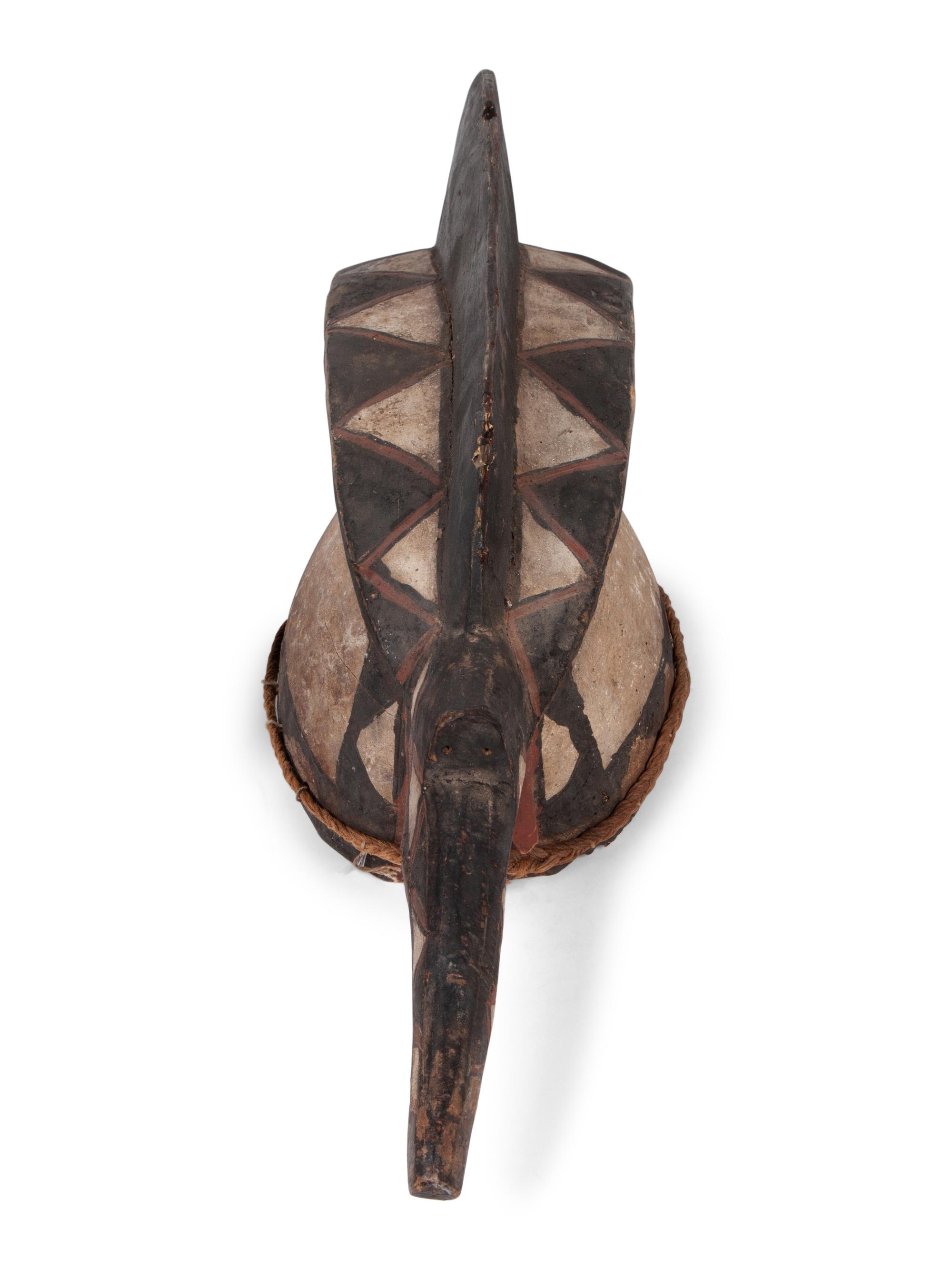 A Group of Ten Carved Ethnographic Masks