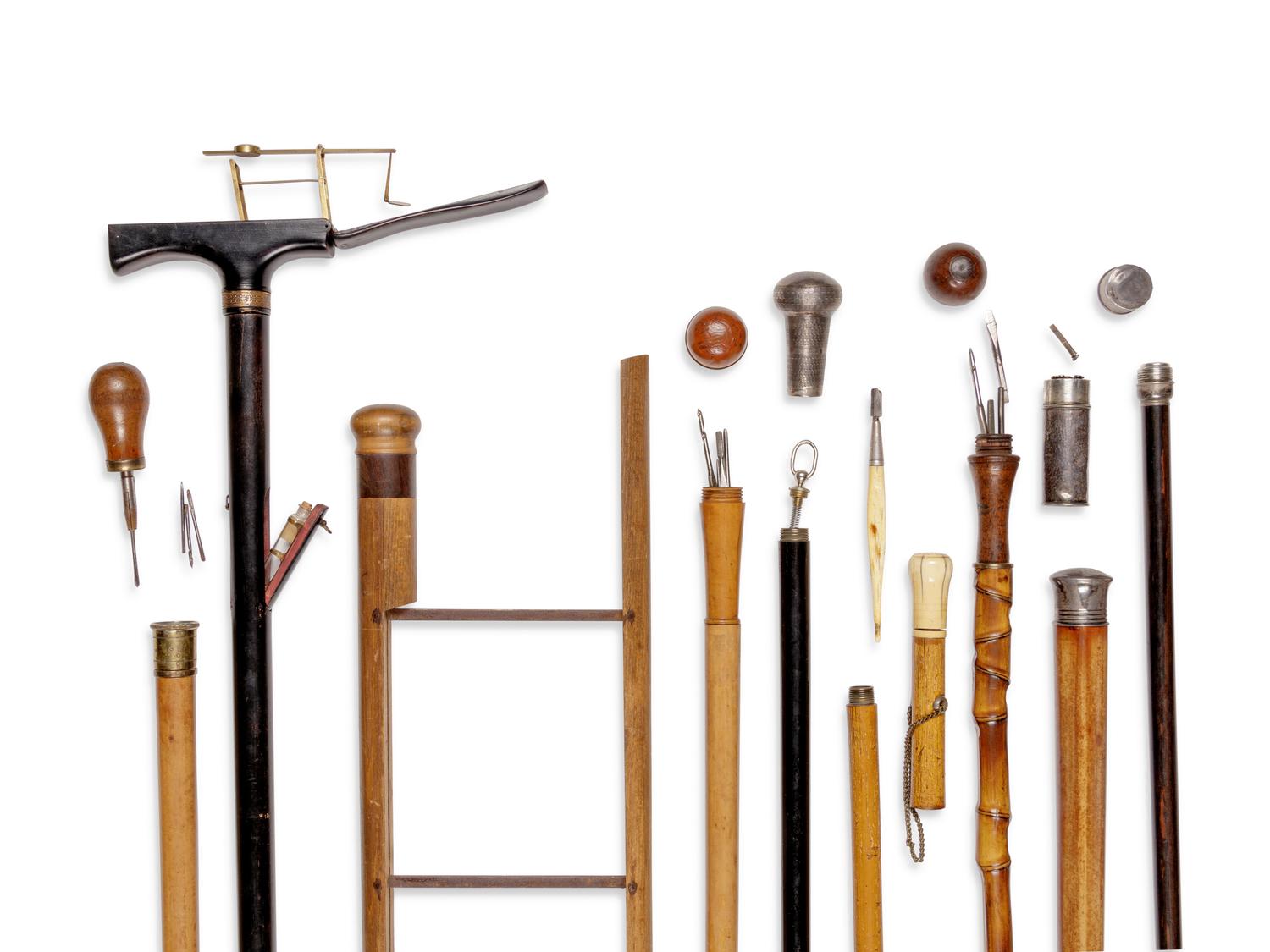 Nine English and Continental Tool System Walking Sticks