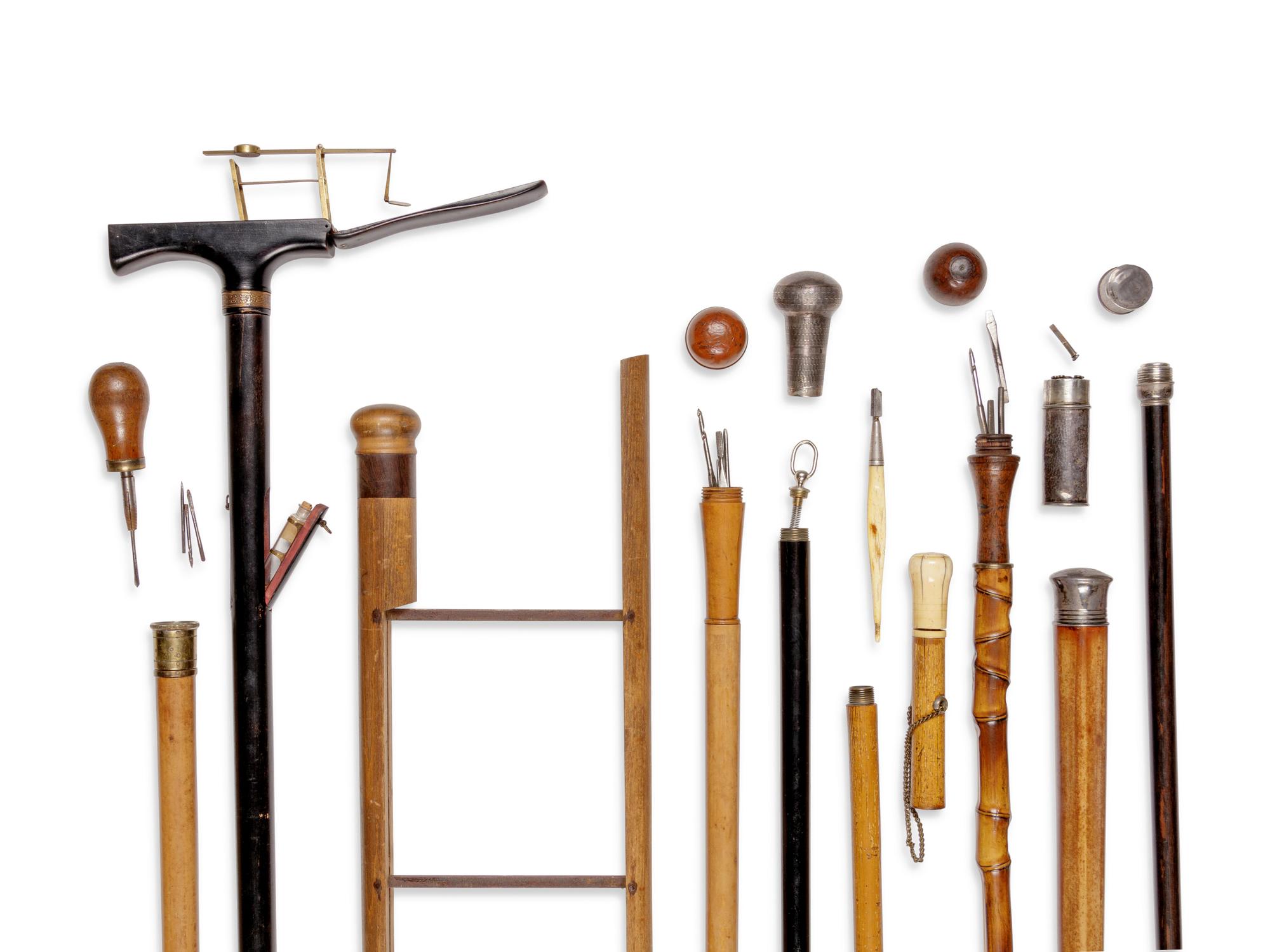 Nine English and Continental Tool System Walking Sticks
