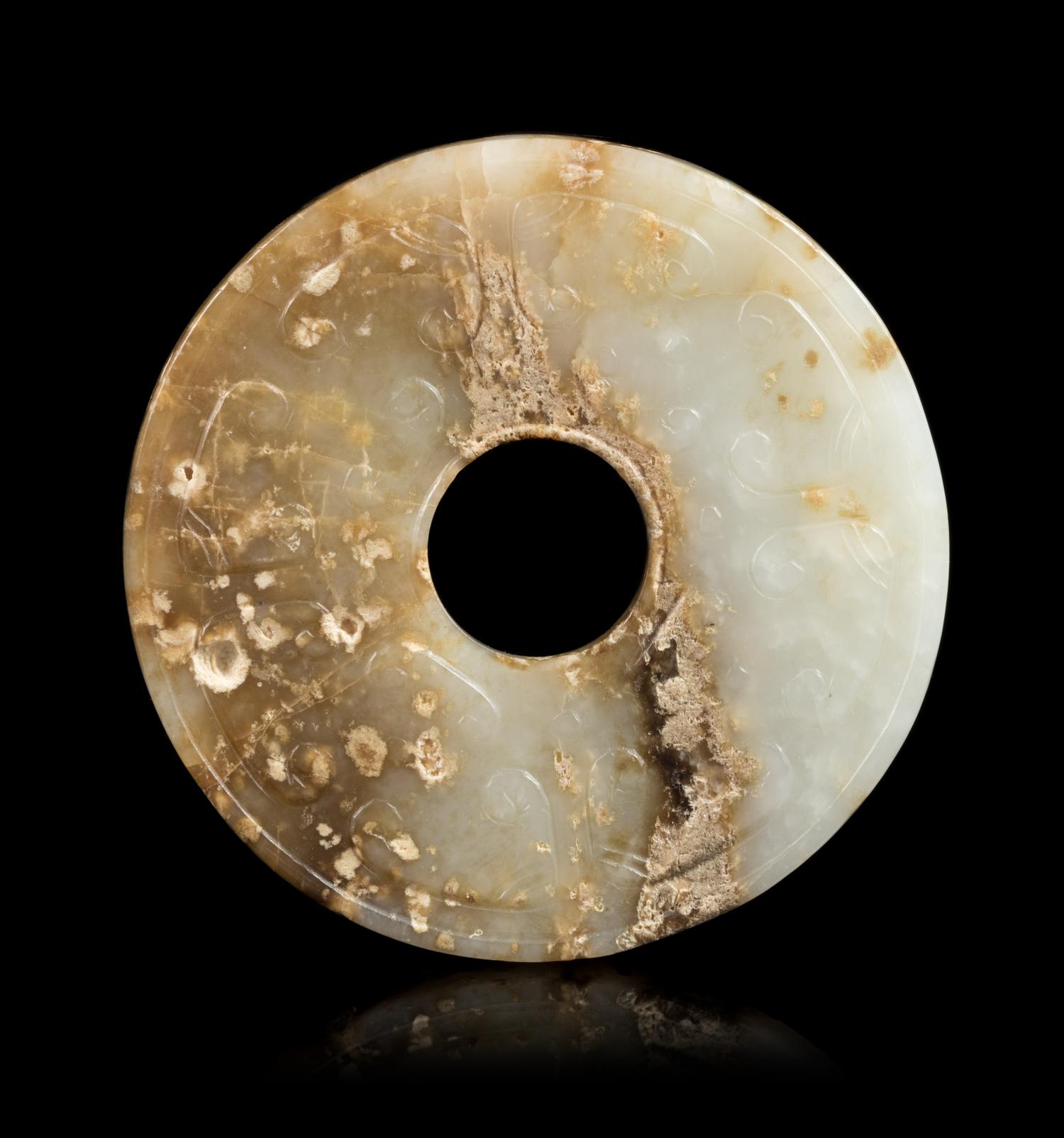 A Jade Bi Disc Diameter 2 3/4 inches. — HAN DYNASTY (206 B.C. - 220 A.D.)