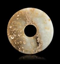 A Jade Bi Disc Diameter 2 3/4 inches. — HAN DYNASTY (206 B.C. - 220 A.D.)