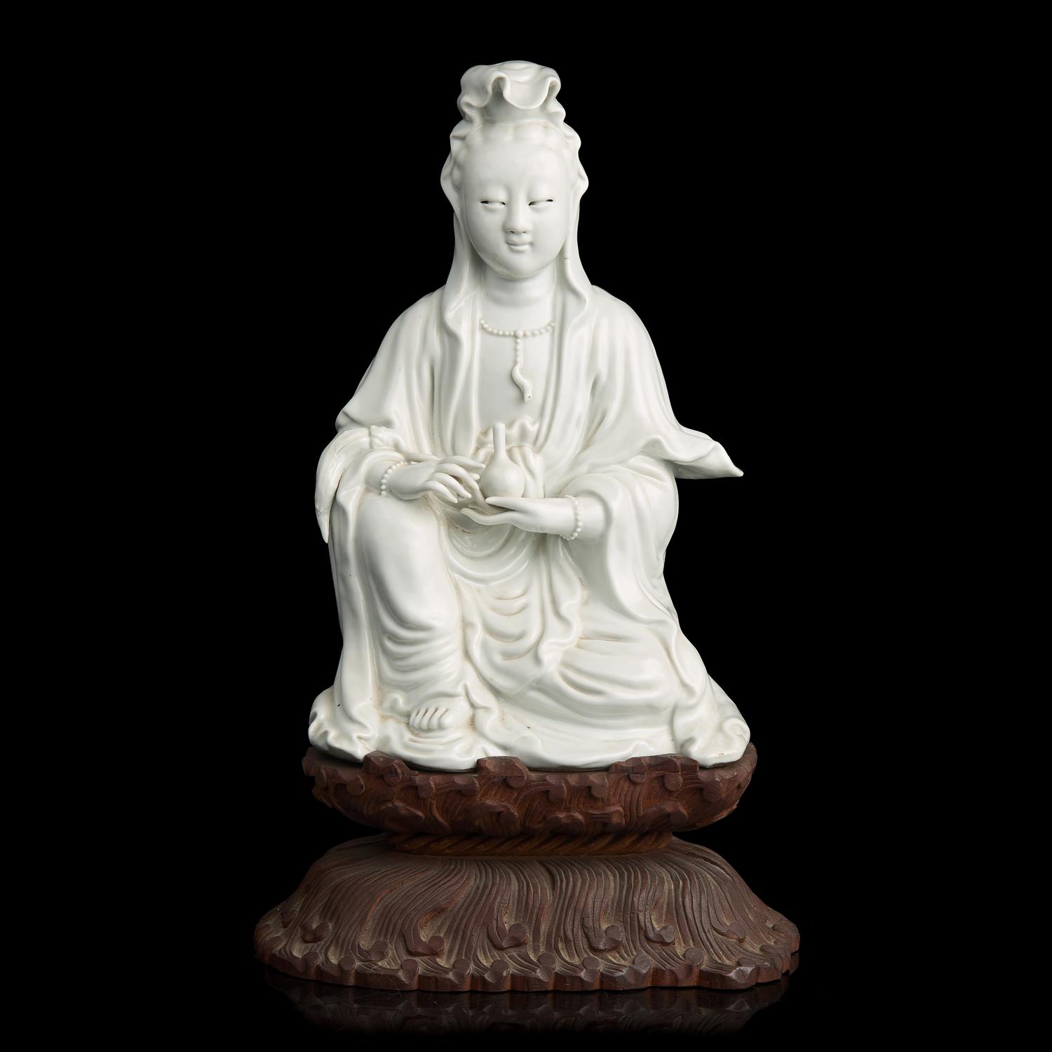 A Chinese Blanc de Chine Figure of Guanyin, Late 19th to 20th Century 晚清民國 德化白瓷觀音坐像