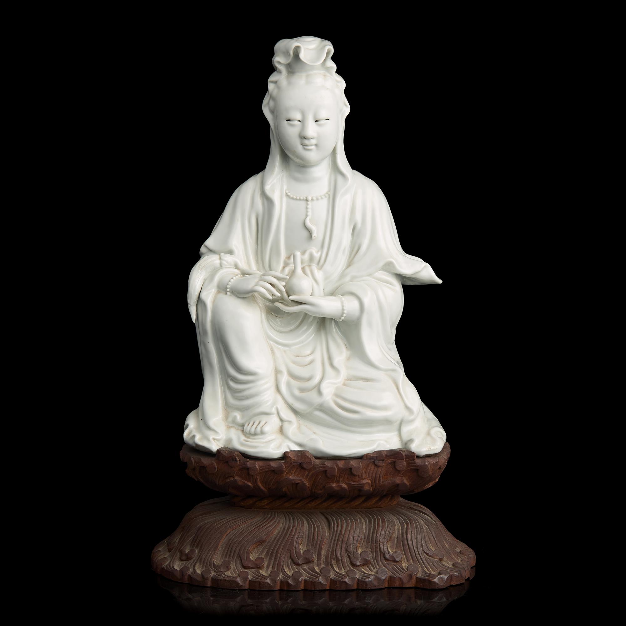 A Chinese Blanc de Chine Figure of Guanyin, Late 19th to 20th Century 晚清民國 德化白瓷觀音坐像