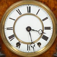 A Black Forest Inlaid Burr-Walnut Cuckoo Clock