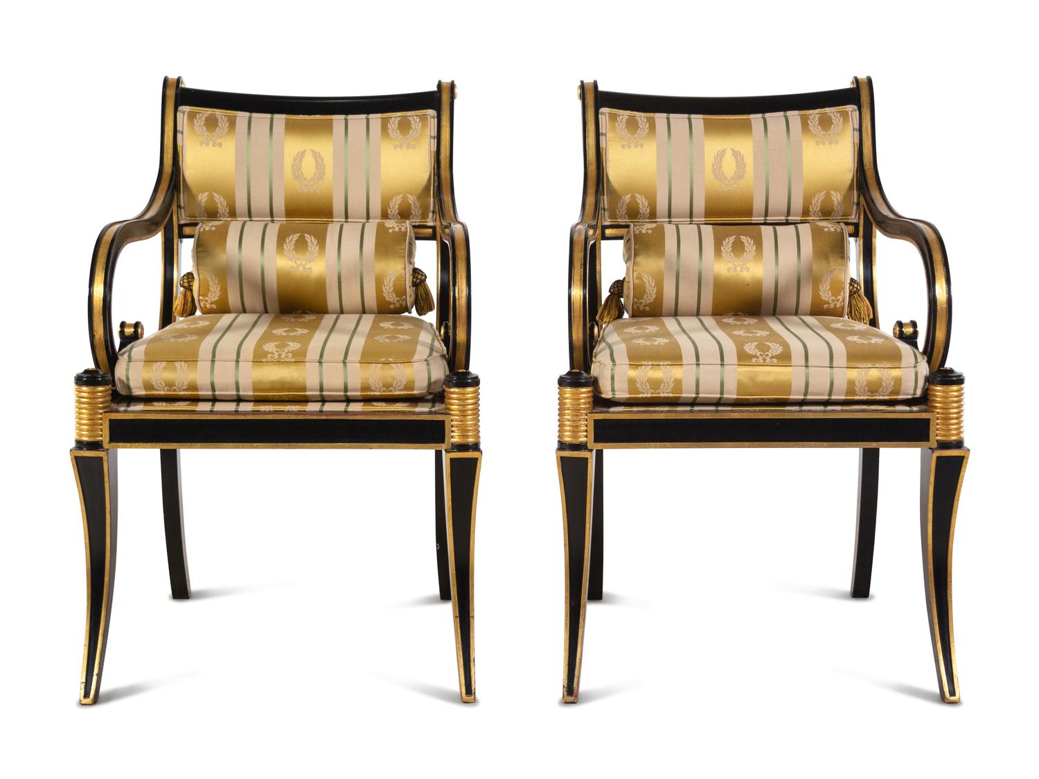 A Pair of Regency Style Parcel Gilt and Ebonized Armchairs