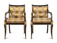 A Pair of Regency Style Parcel Gilt and Ebonized Armchairs