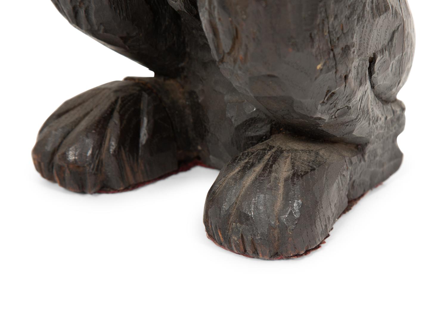 An English Carved and Stained Oak Figure of a Lion