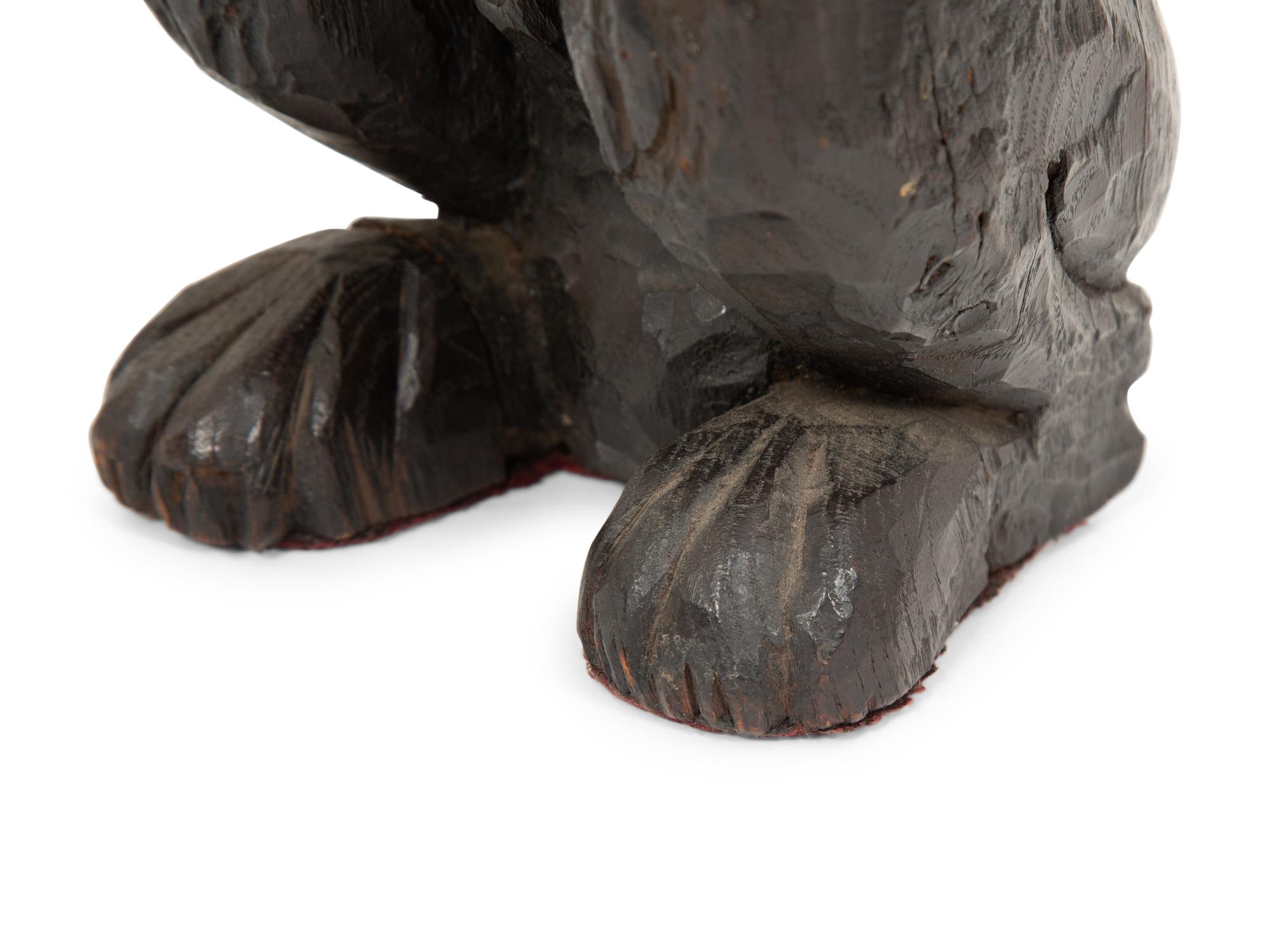 An English Carved and Stained Oak Figure of a Lion